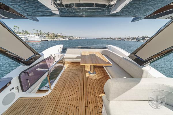 Luxurious 2025 Sunseeker Manhattan 68 yacht with spacious deck and elegant seating area.