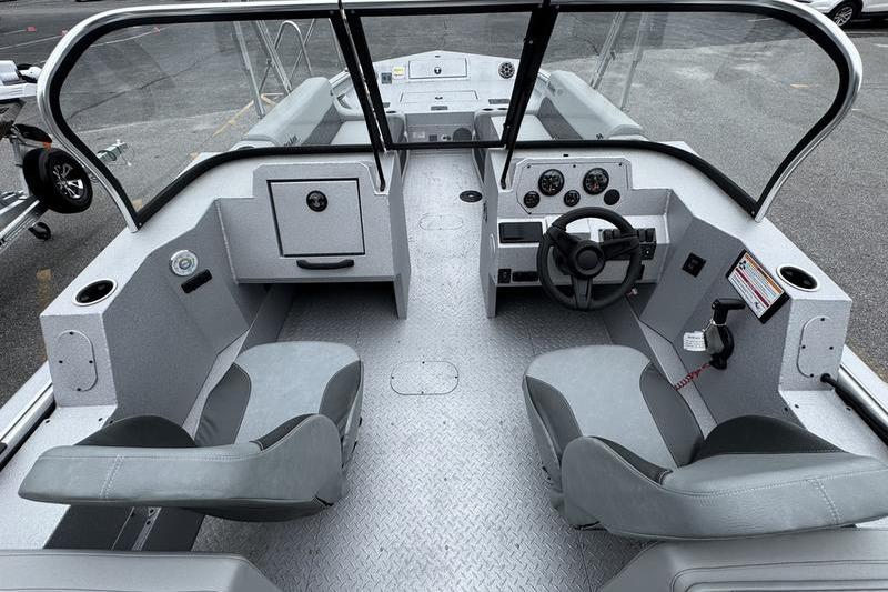 2025 SeaArk Super Lounge Easy boat interior with dual seats and steering console.