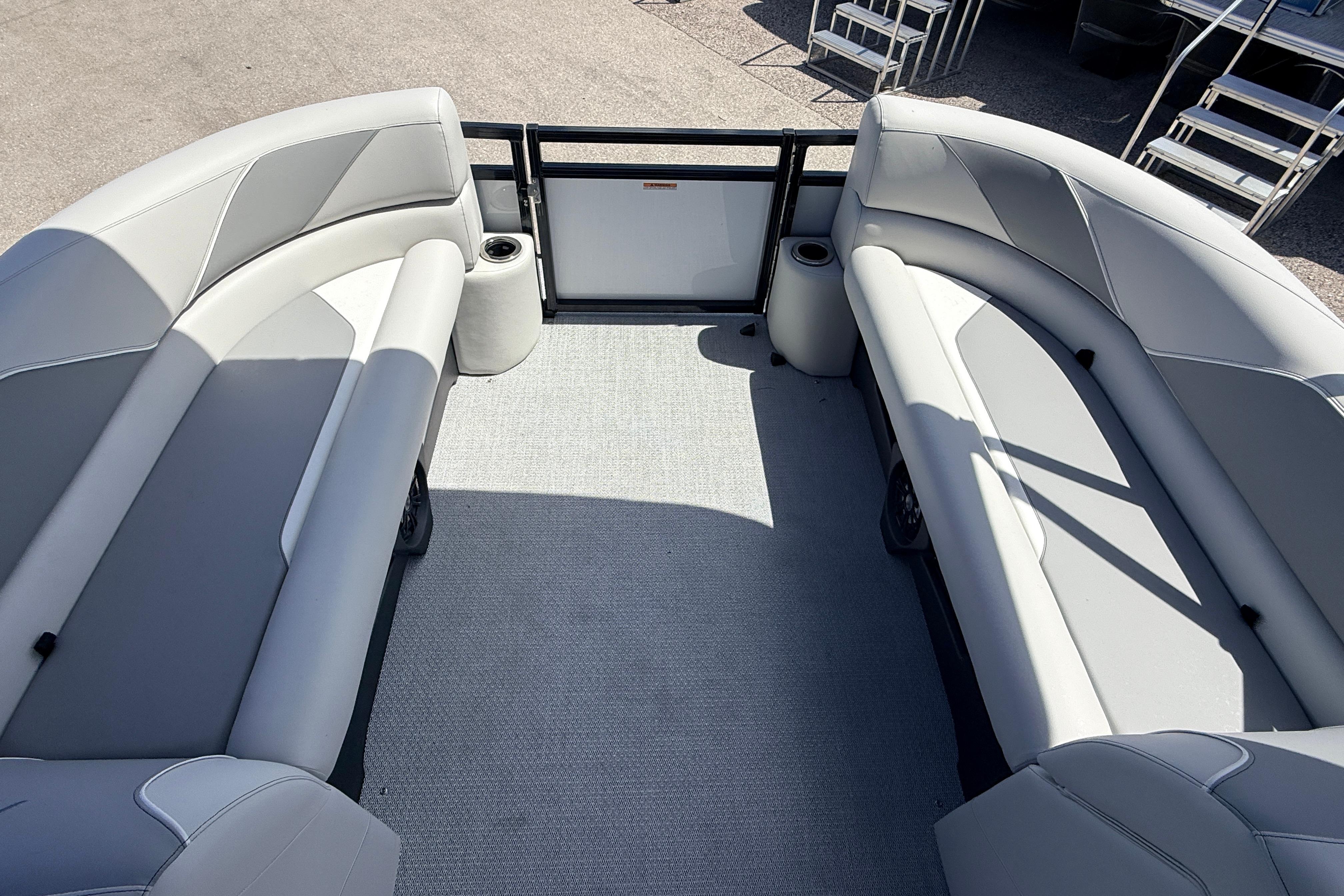 2026 Avalon 2385 Venture 85 Tri Toon boat interior with spacious seating and cup holders.
