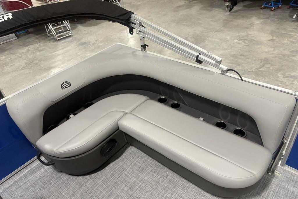 2026 Sun Tracker Party Barge 16 DLX interior seating with cup holders.