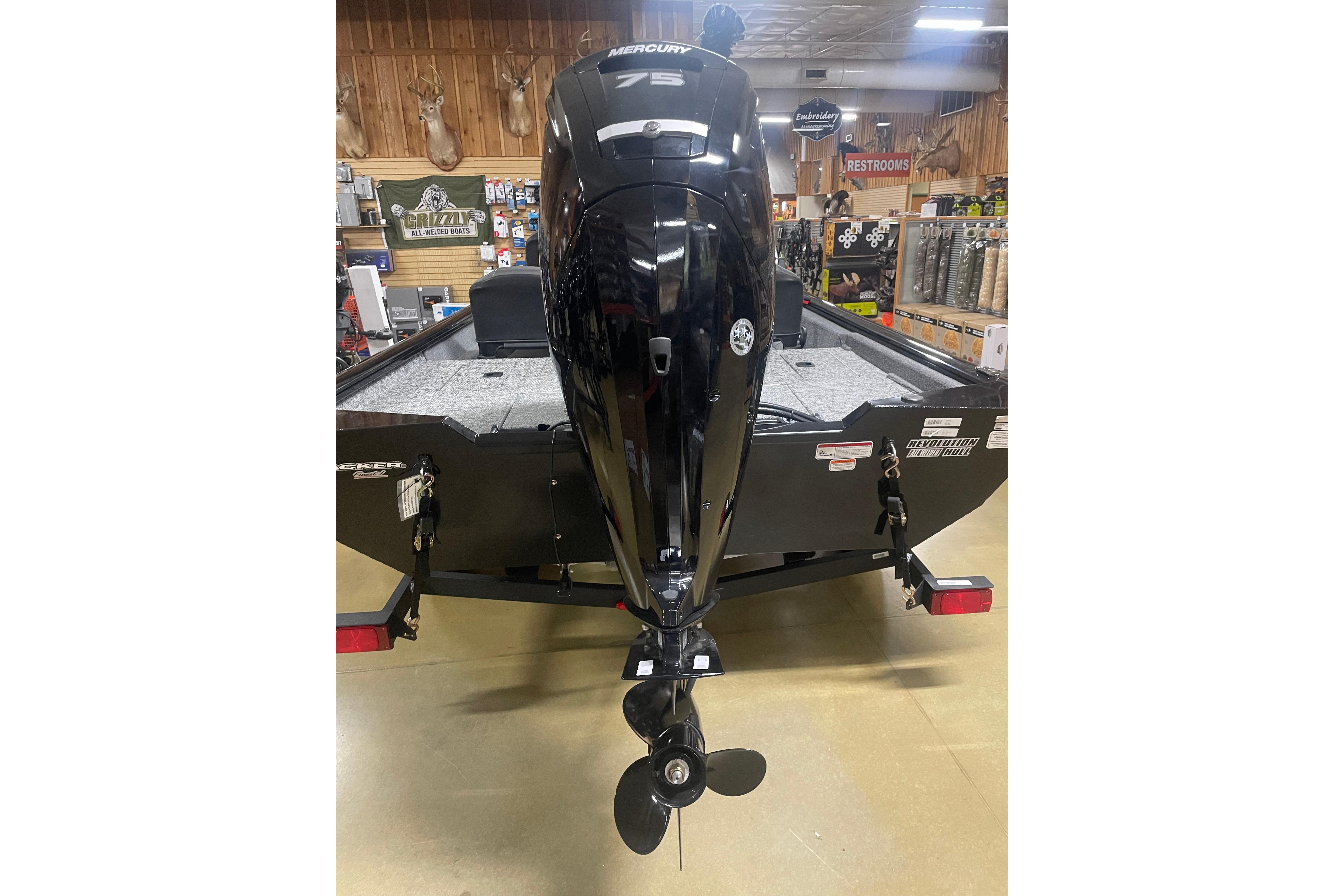 2026 Tracker Pro Team 175 Crappie Edition boat with Mercury outboard motor in showroom.