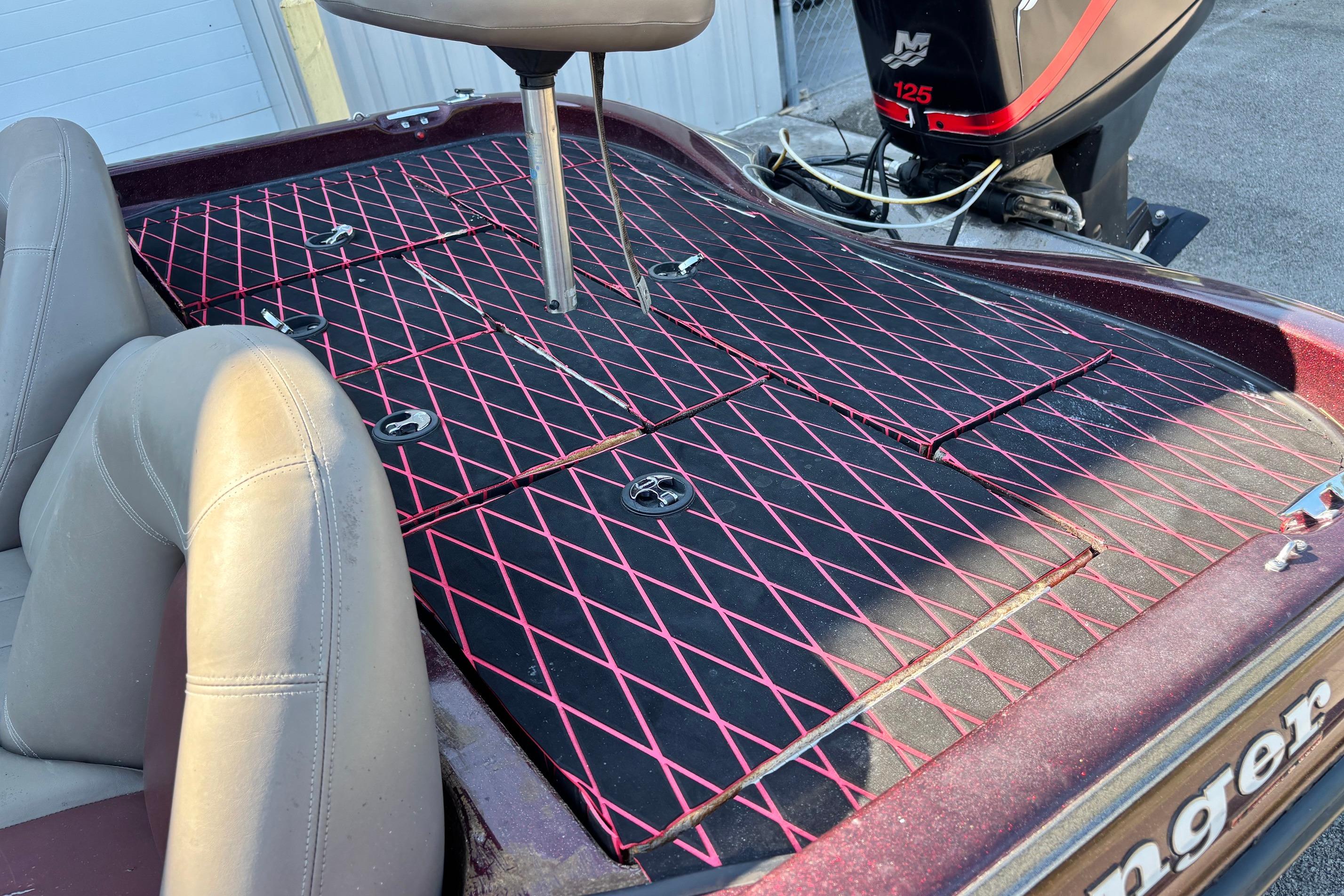 2004 Ranger 175SVS boat interior with red diamond-patterned deck and Mercury 125 outboard motor.