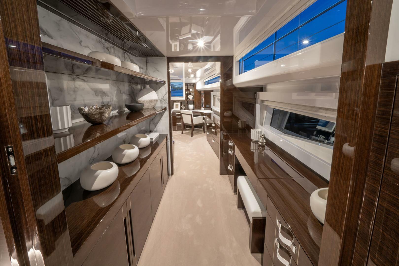 Luxurious interior of 2020 Pearl 95 yacht with elegant wood finishes and modern decor.