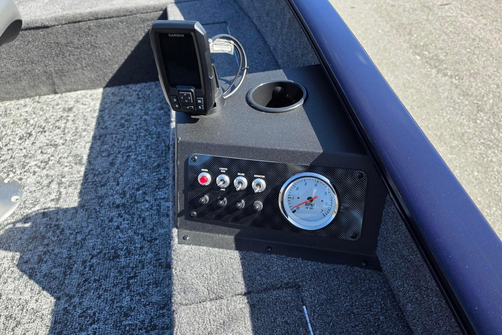 Control panel of 2026 Tracker Super Guide V-16 T boat with Garmin device and RPM gauge.