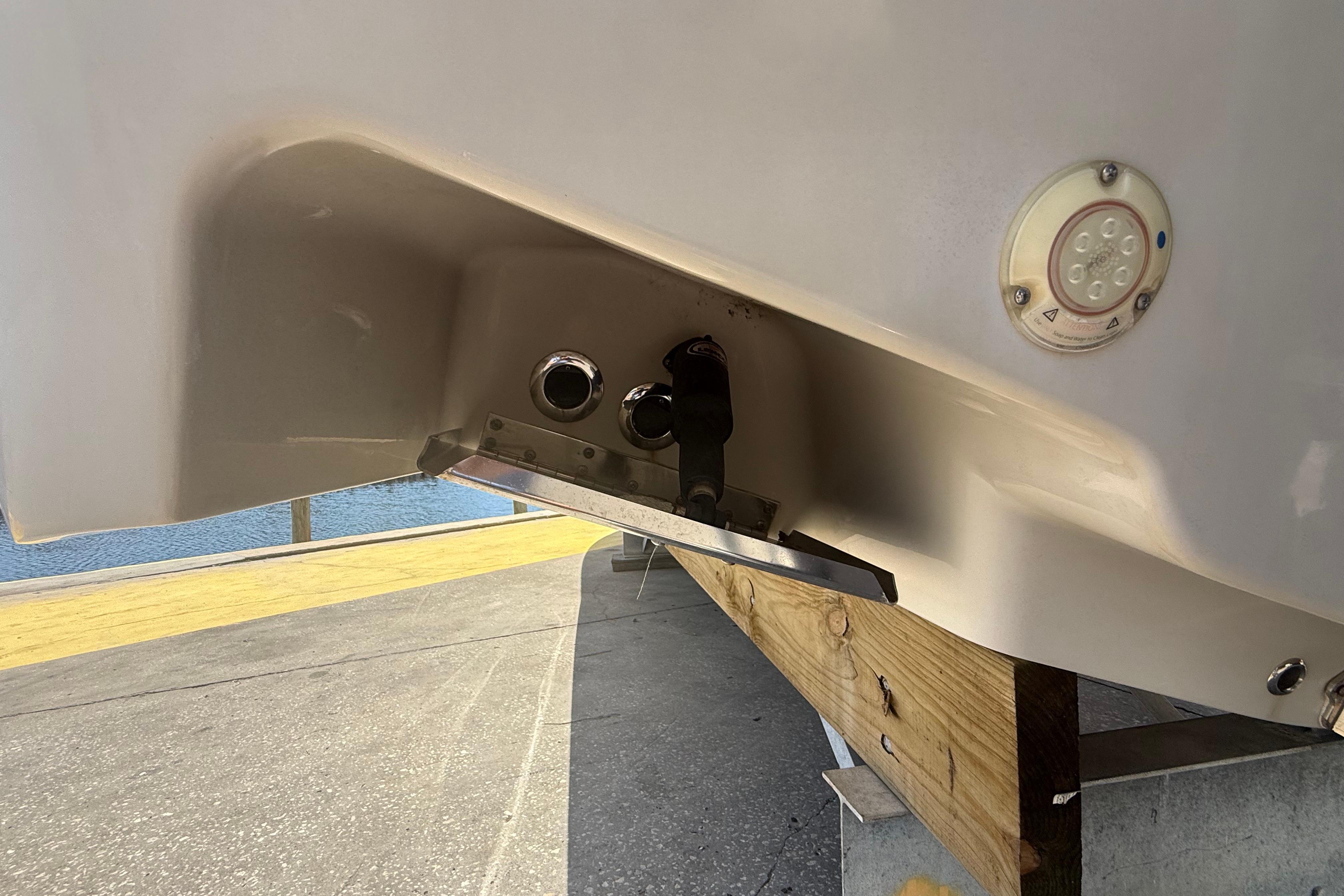 2019 Key West Billistic 281 Center Console boat hull detail with fittings and light.