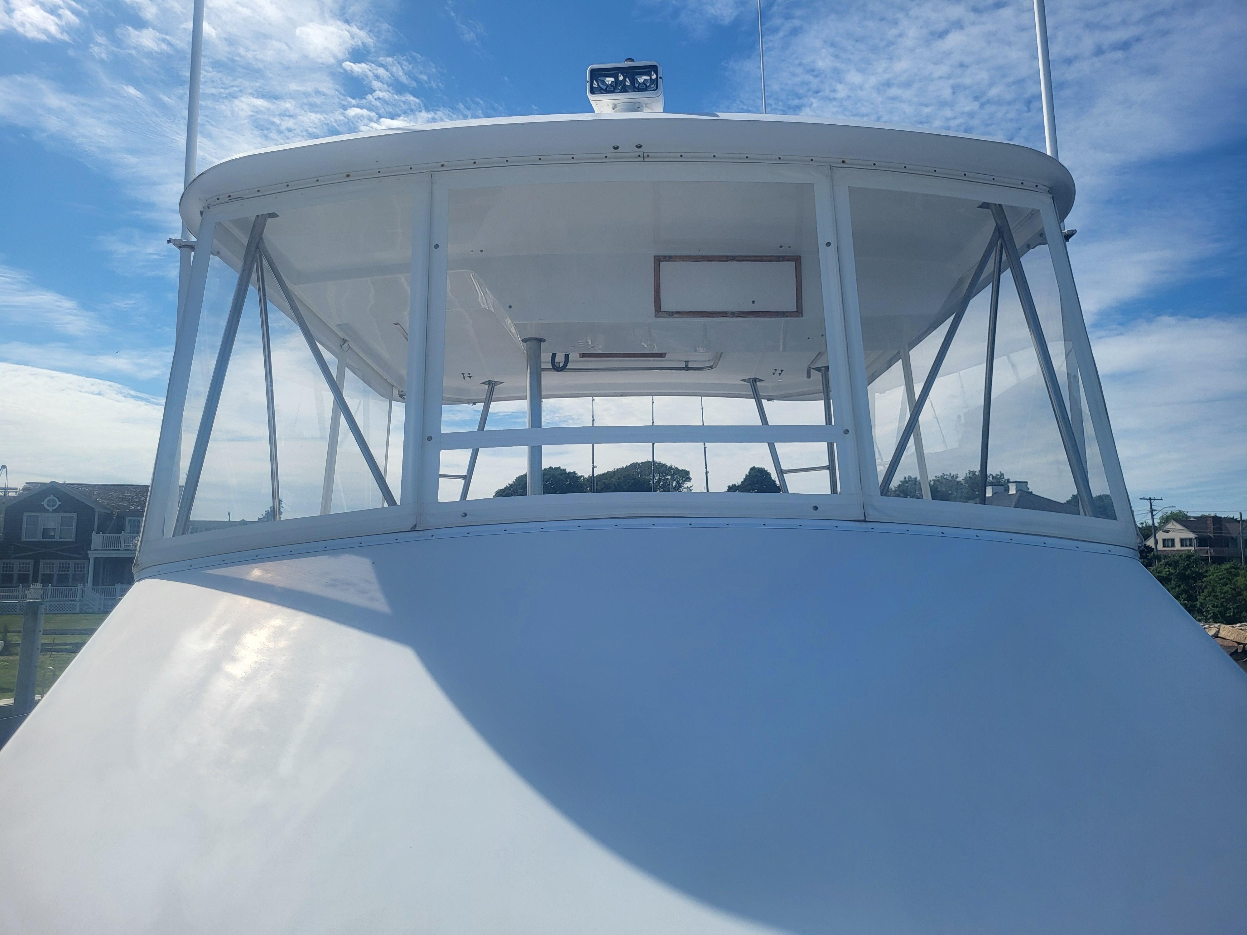 1989 Ocean Yachts 48 boat bridge with clear skies and coastal background.