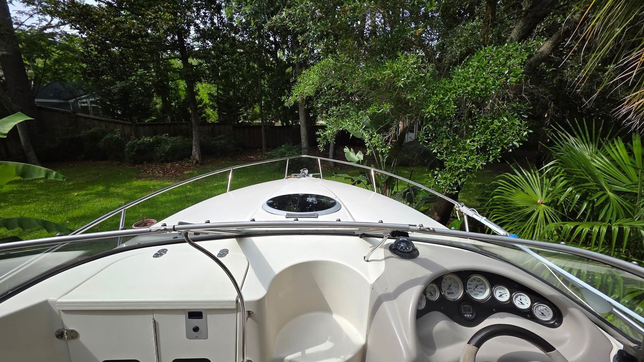2006 Stingray 250 CR parked on grass, featuring cockpit and dashboard.