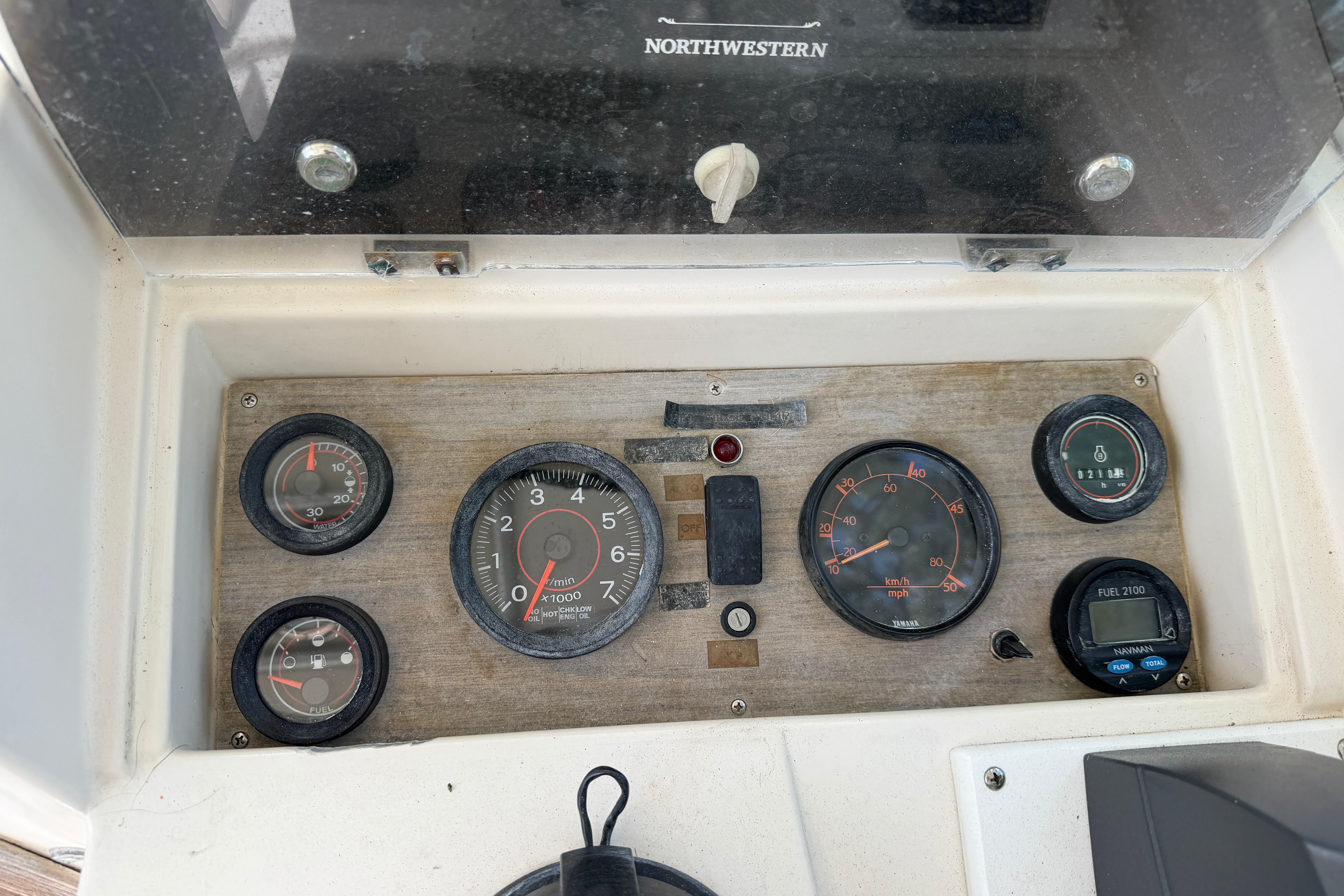 Dashboard of a 1987 Grady-White Seafarer 226 boat with various gauges and controls.