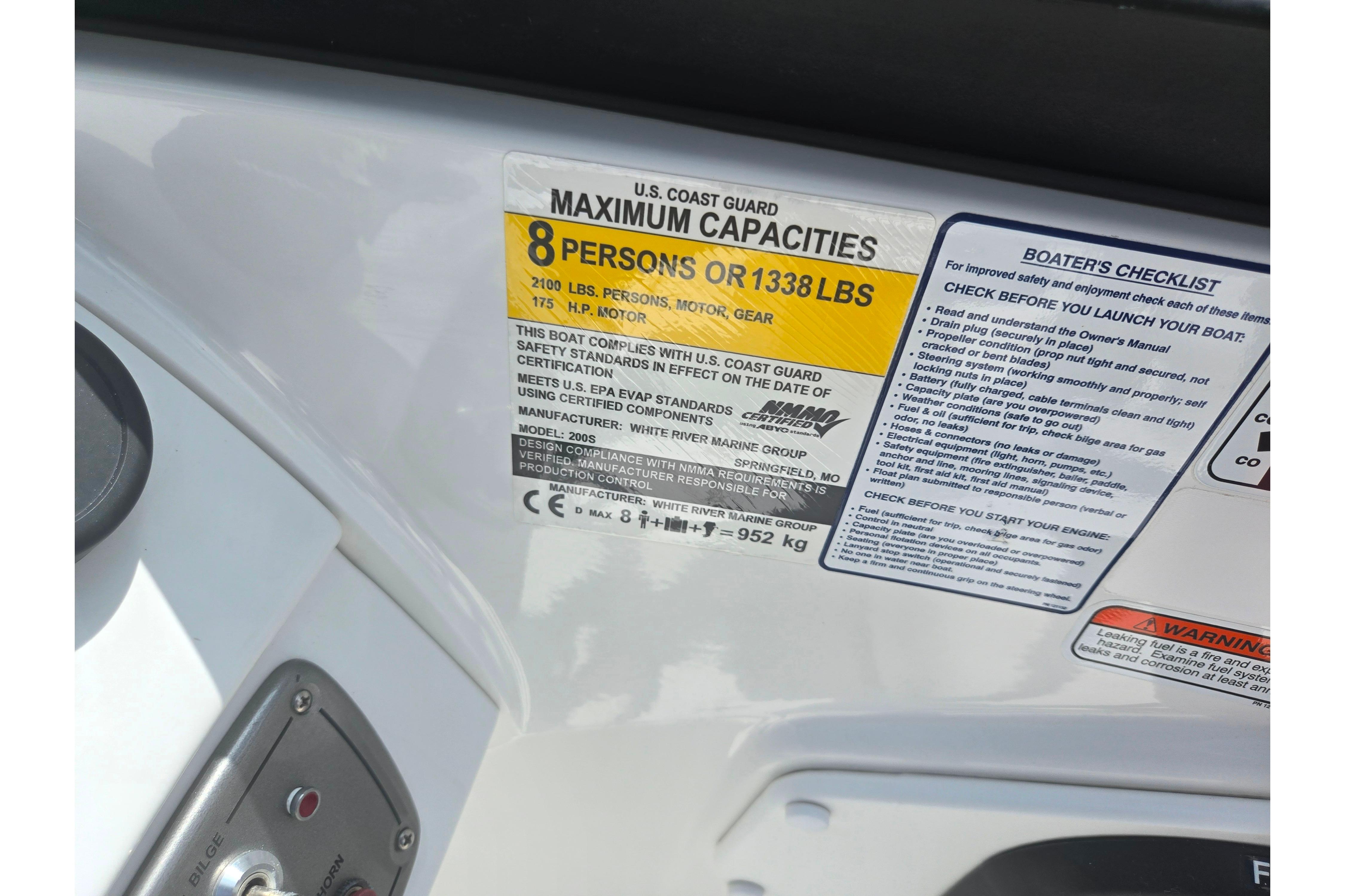 2023 Tahoe 200 S boat capacity label, seating 8 people or 1338 lbs, with safety checklist.