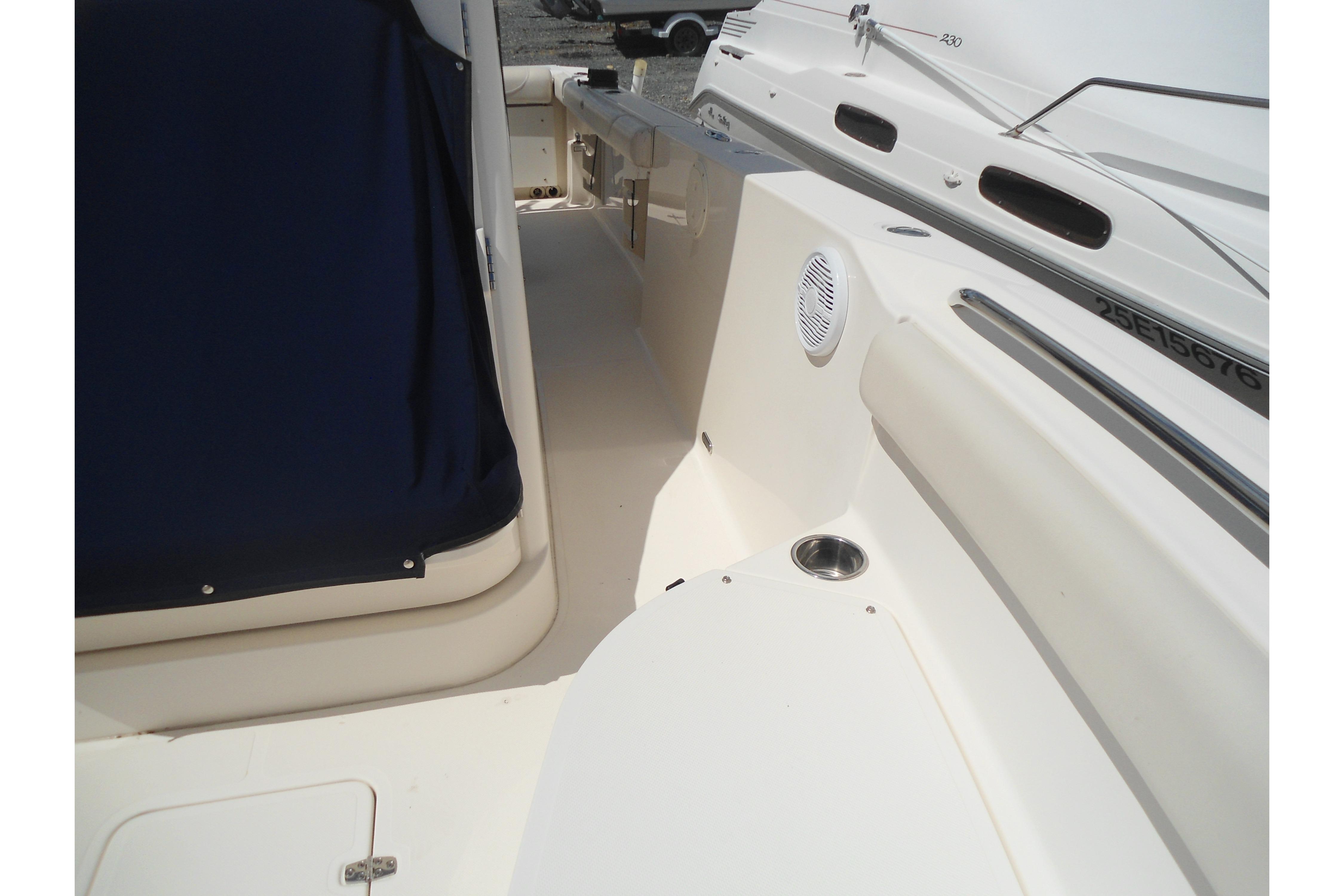 2013 Pursuit C 260 Center Console boat interior with seating and cup holder.