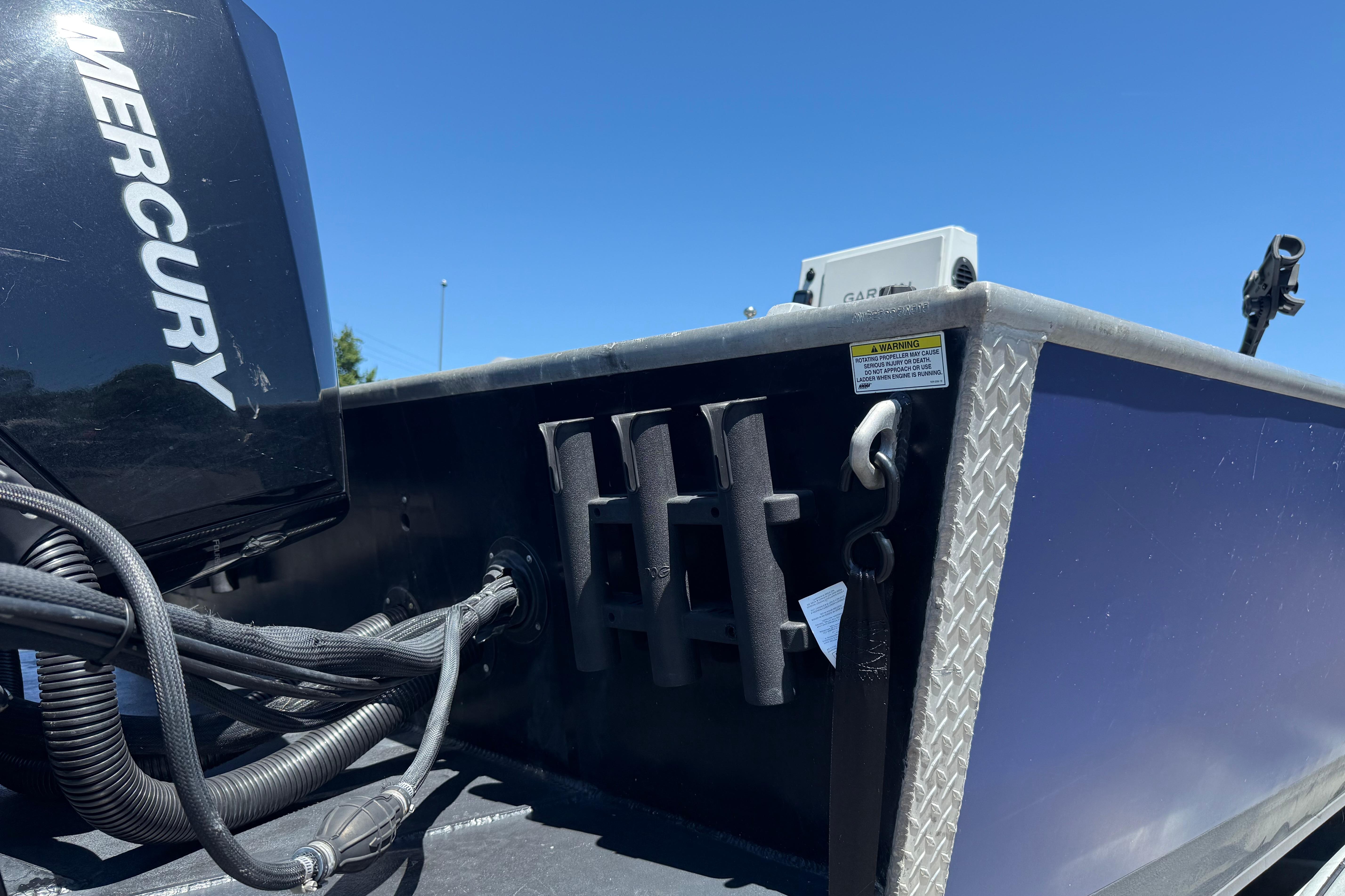 2015 Alumaweld Pacific XD 28 boat with Mercury engine, close-up view.