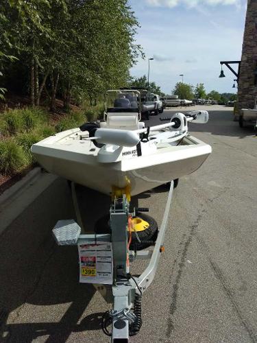 2024 Ranger RB200 boat on trailer, parked outdoors near trees and buildings.