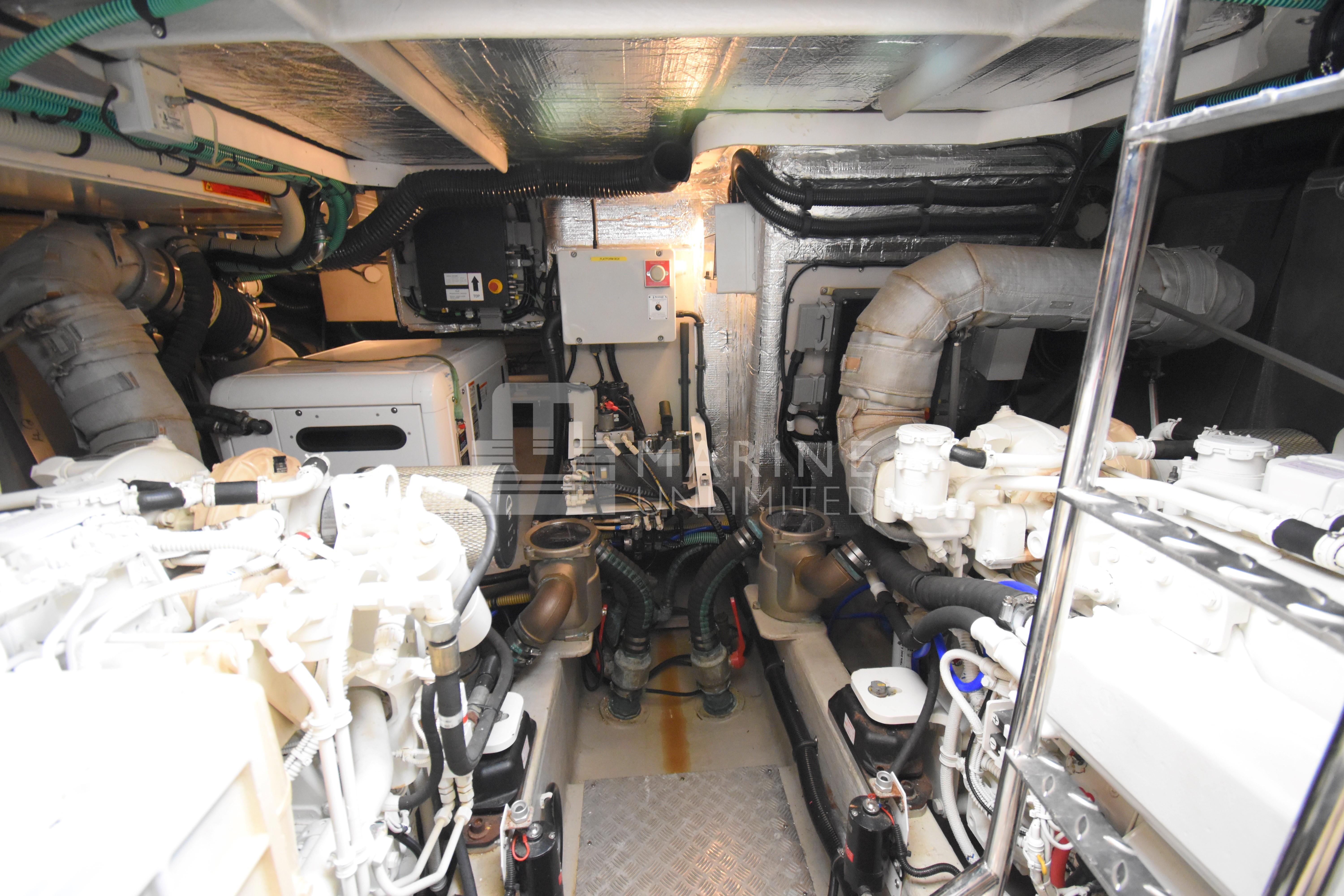 Engine room of 2010 Sunseeker Manhattan 52 yacht, showcasing mechanical components and systems.
