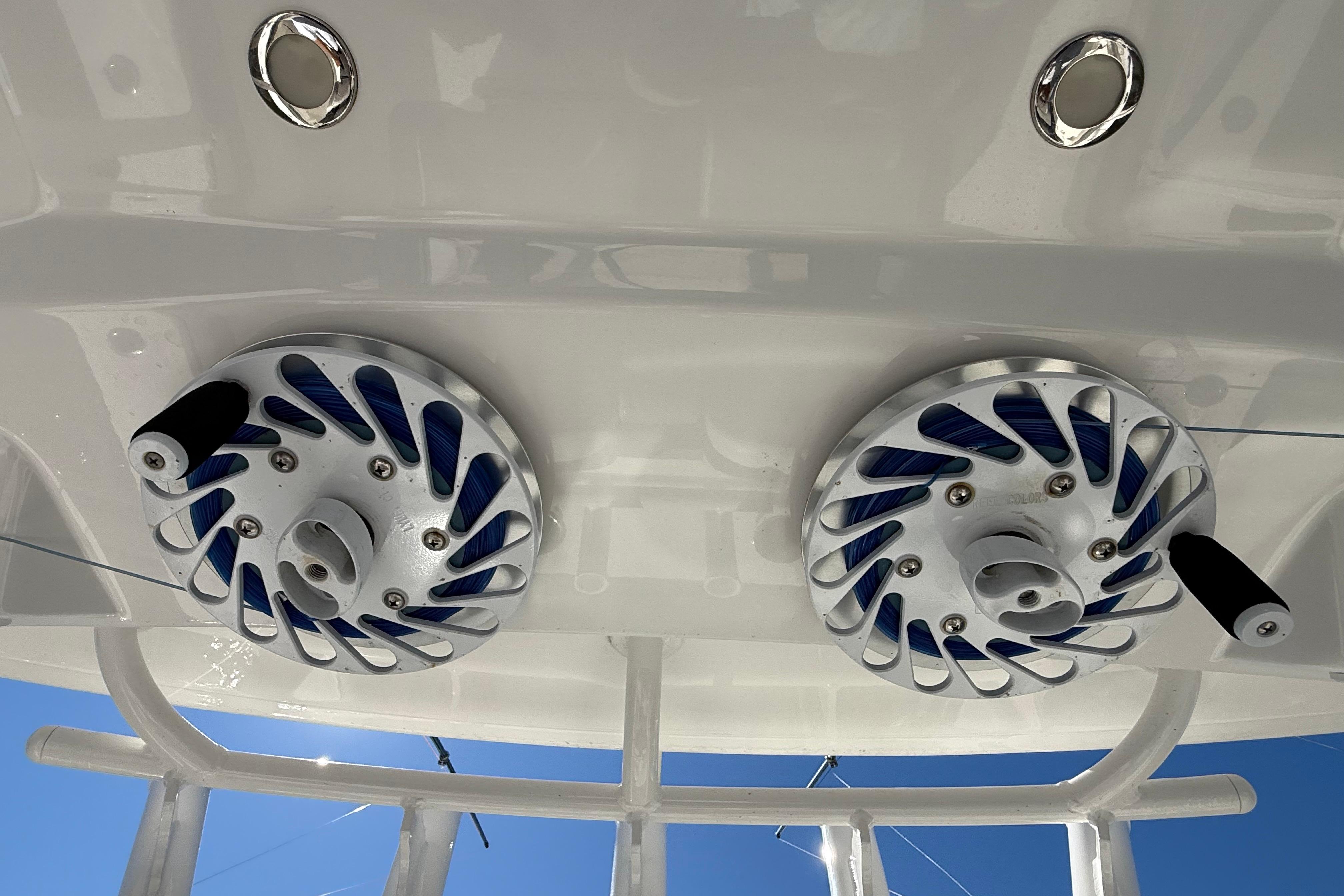 2022 Regulator 34 boat with dual fishing reel holders on white deck.