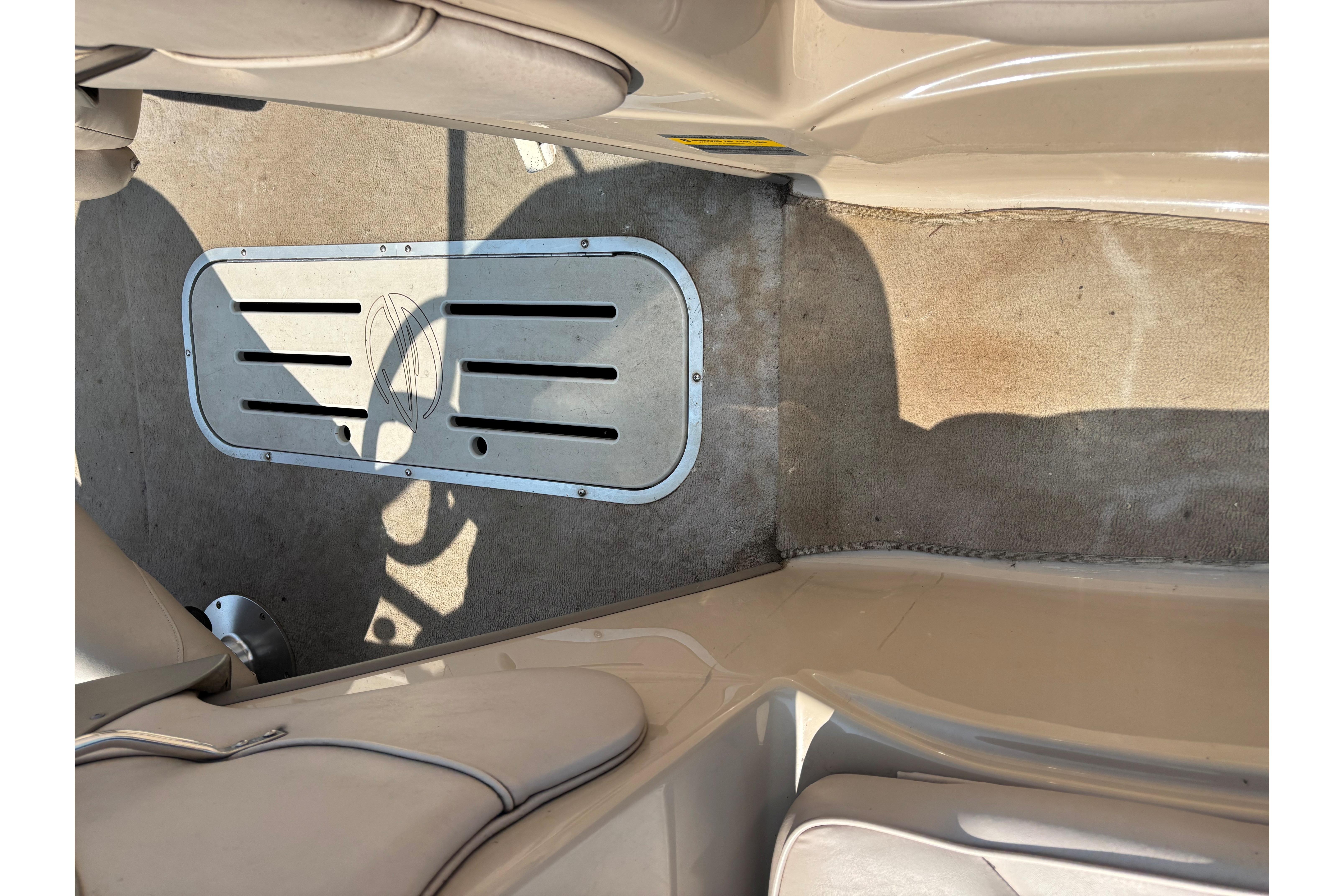 Interior of a 2001 Crownline 18' boat showing seating and flooring details.