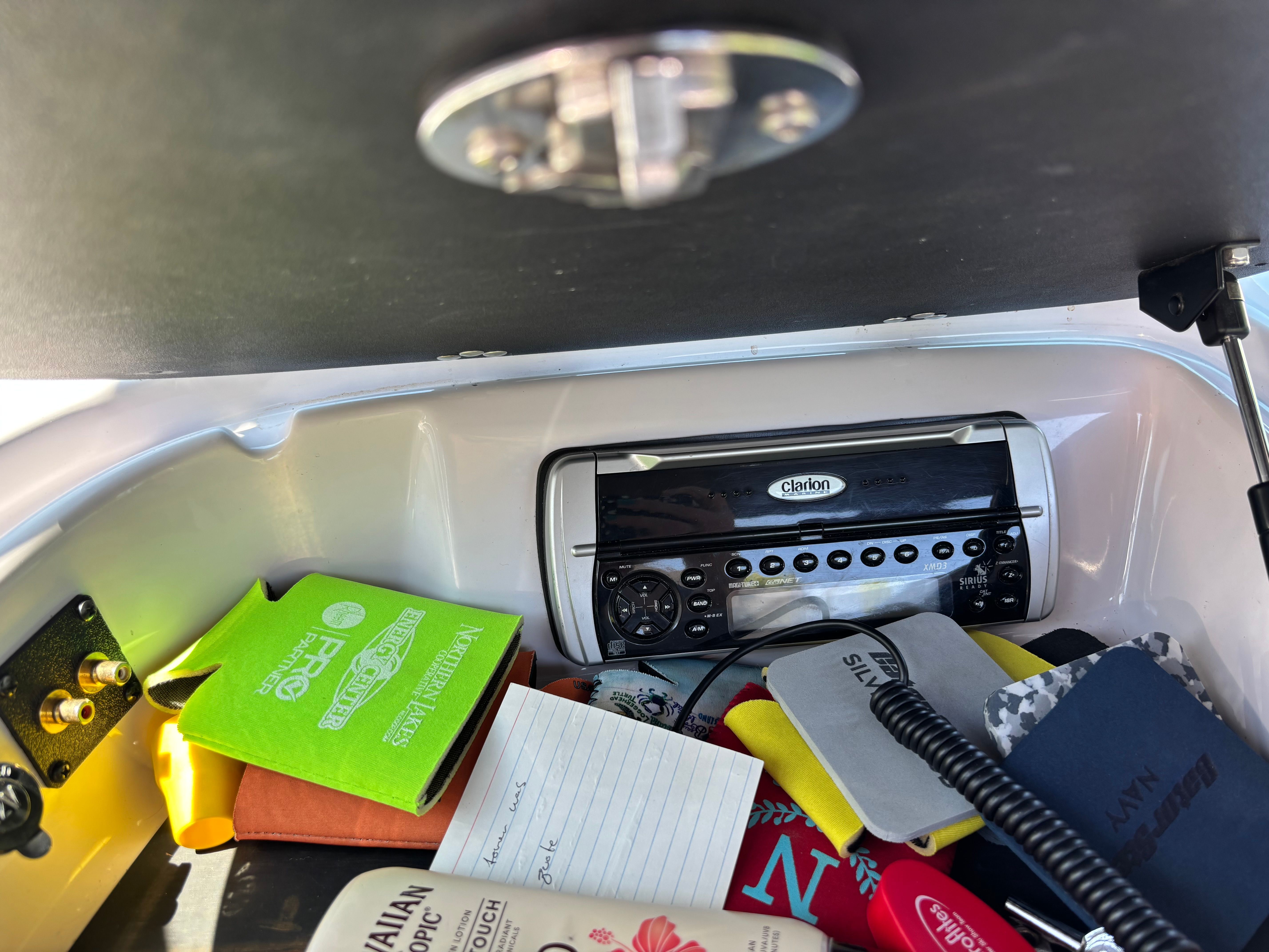 Interior of Nautique Sport SV-211 boat with radio and accessories.