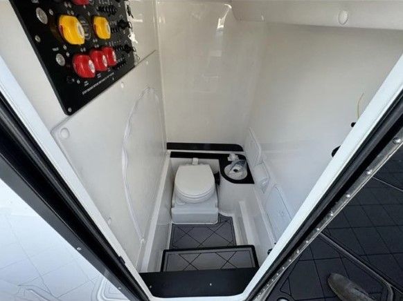 Interior of 2023 Fountain 38 Tournament Edition with toilet and control panel.