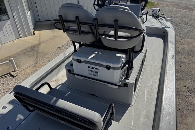 2025 Majek 24 Reaper boat interior with seating and Igloo cooler on deck.