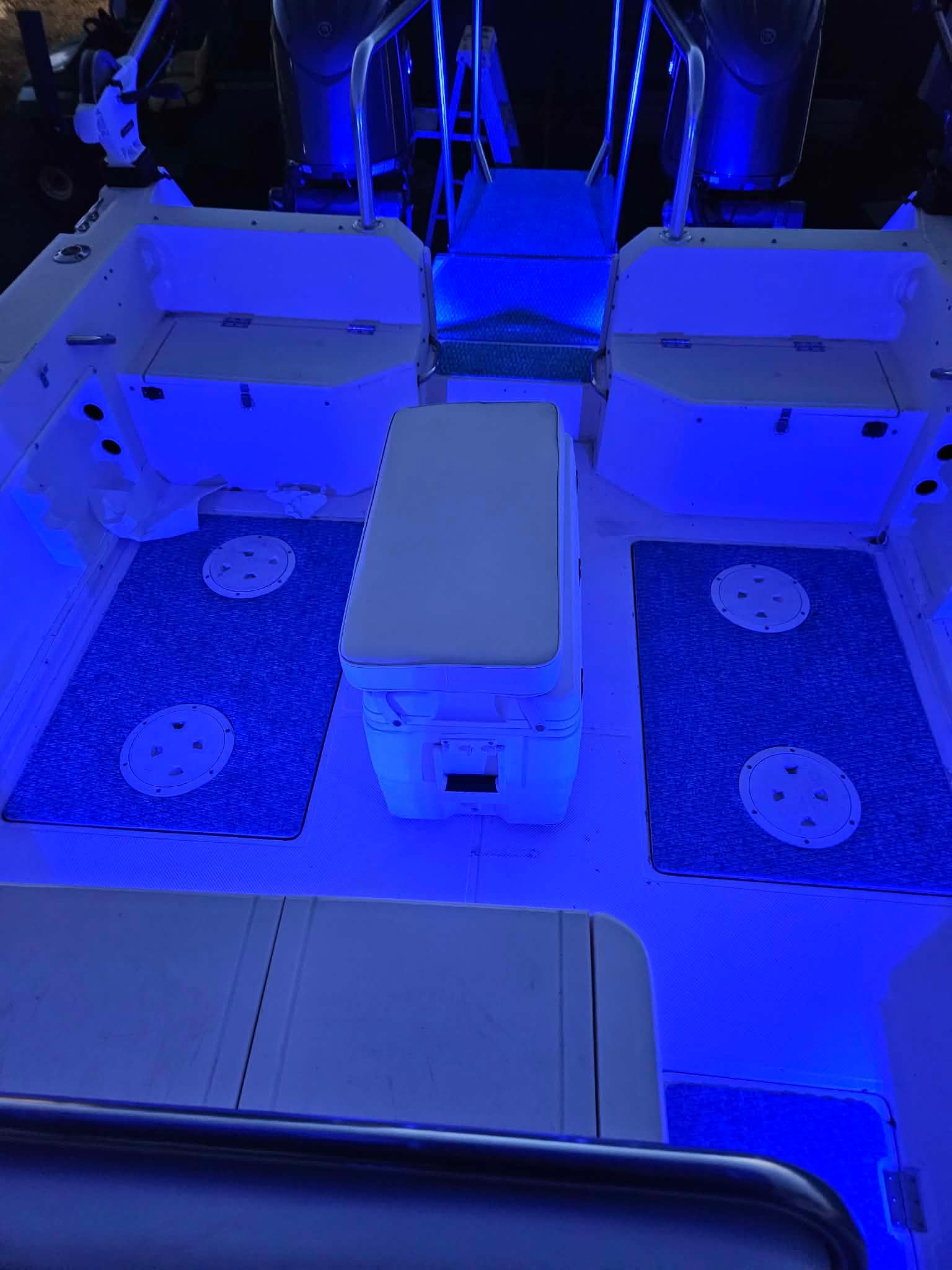 Interior of a 1997 Sea Cat SLC 5 boat, illuminated in blue.