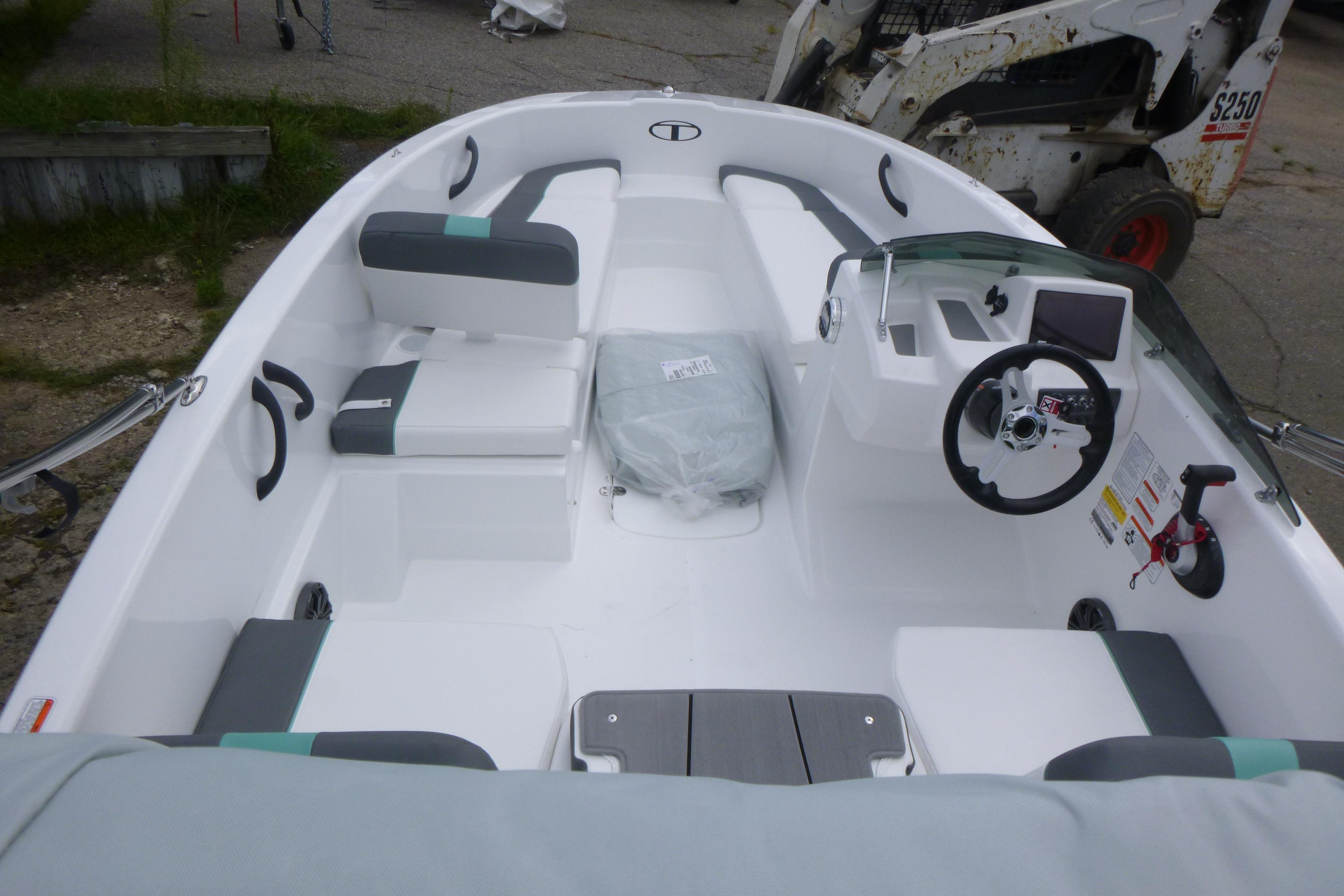 2026 Tahoe T16 boat interior with modern seating and steering console.