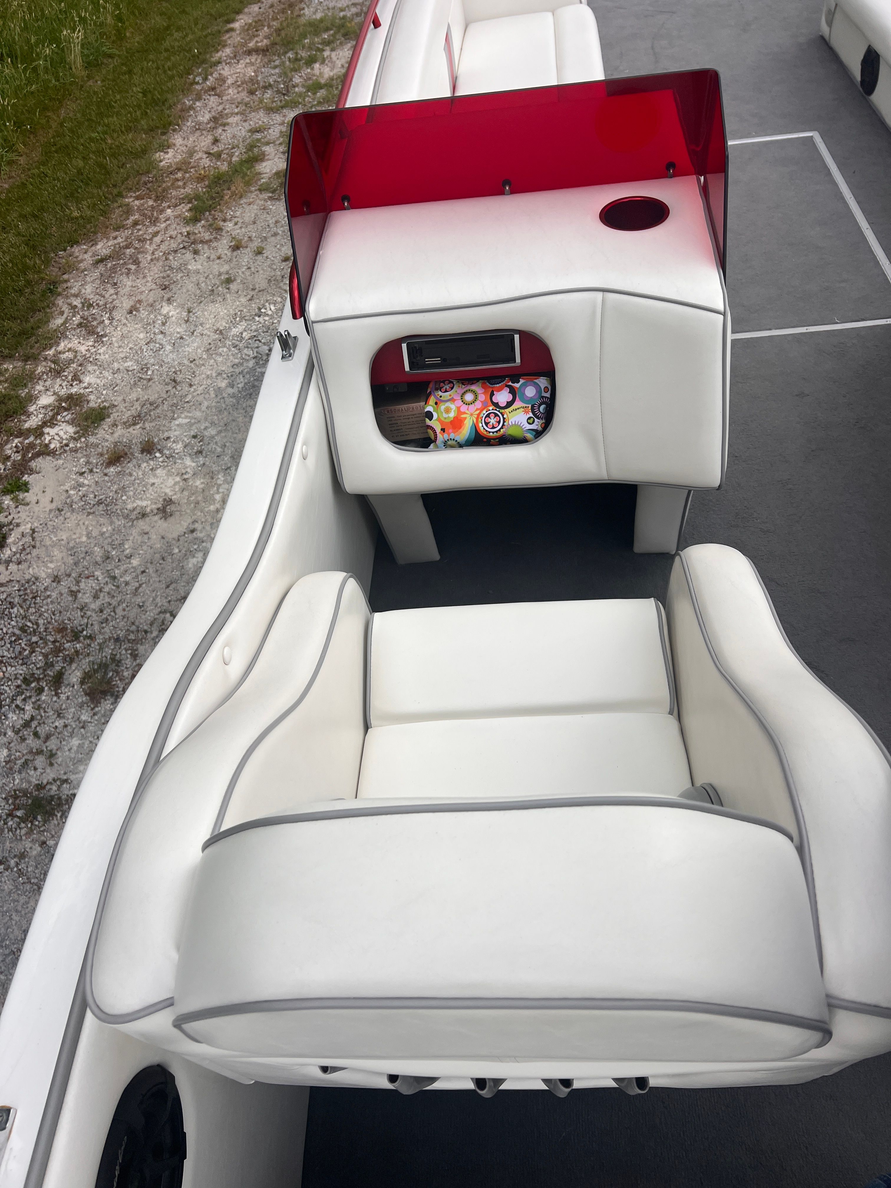 Interior view of a 2008 Cheetah Fastcat with white seats and a red windscreen.