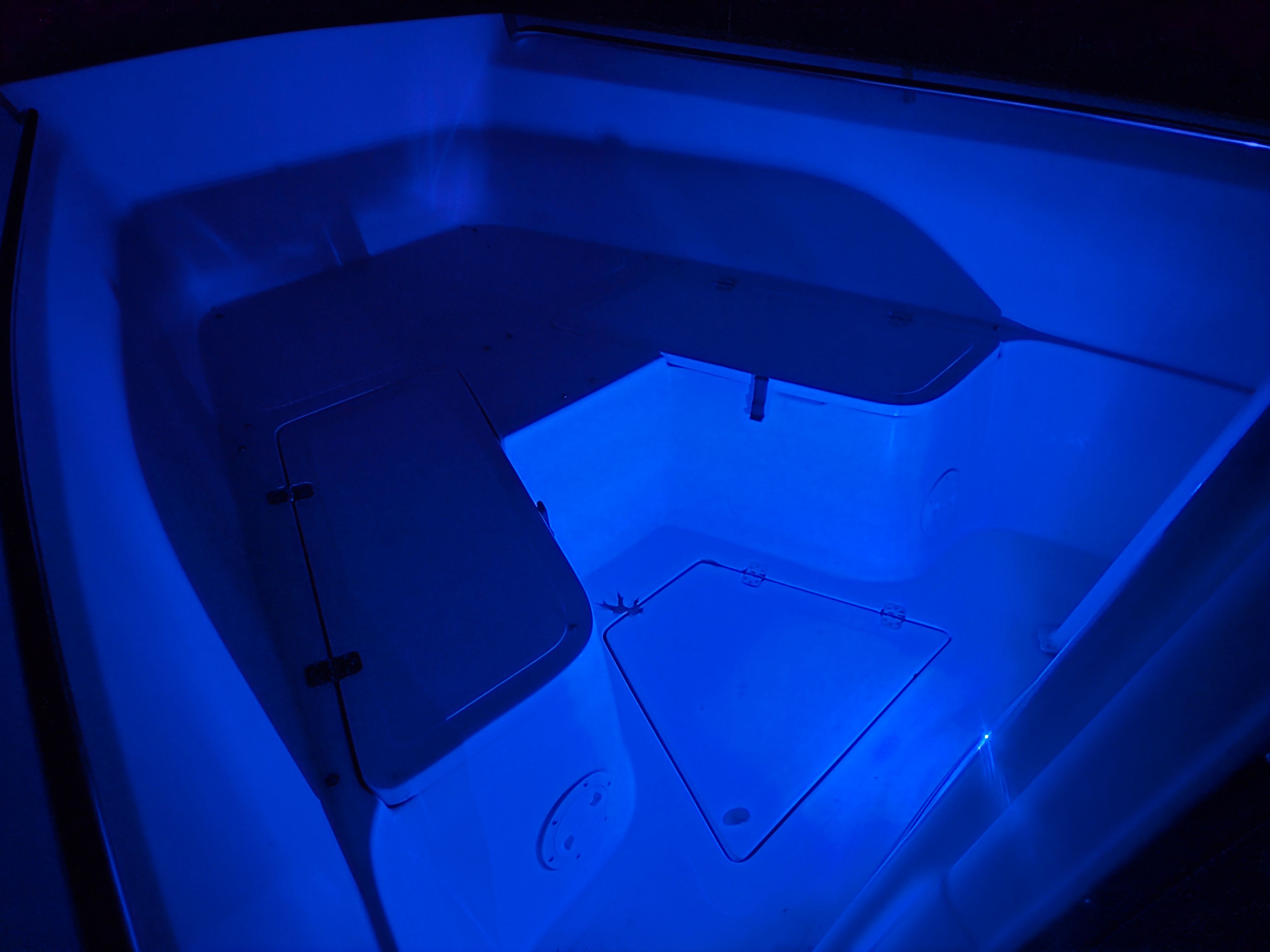 Sailfish 236 CC 2002 boat cabin with night lighting.