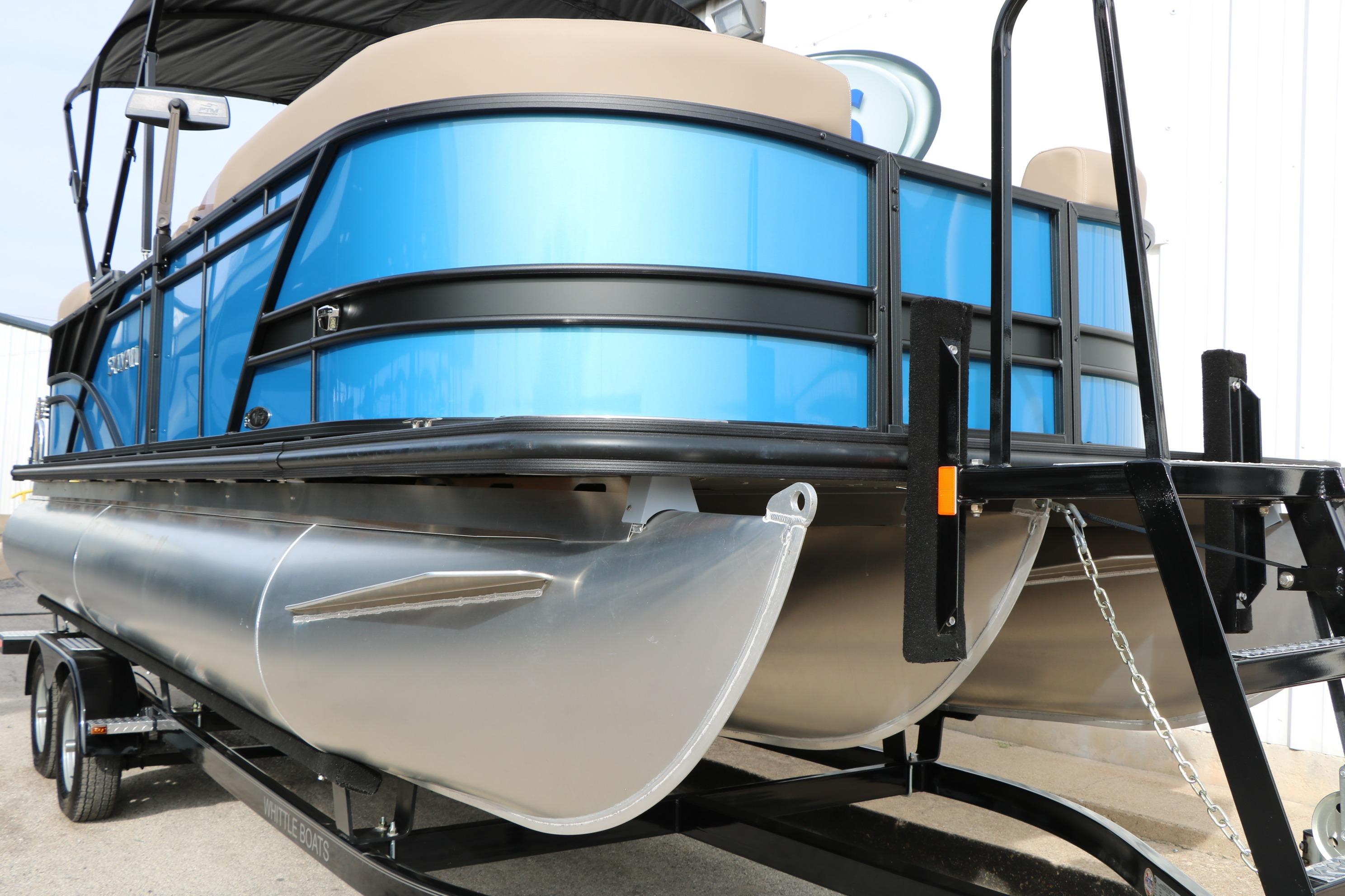 2026 Sylvan Mirage 822 LZ pontoon boat on trailer, featuring sleek blue design.