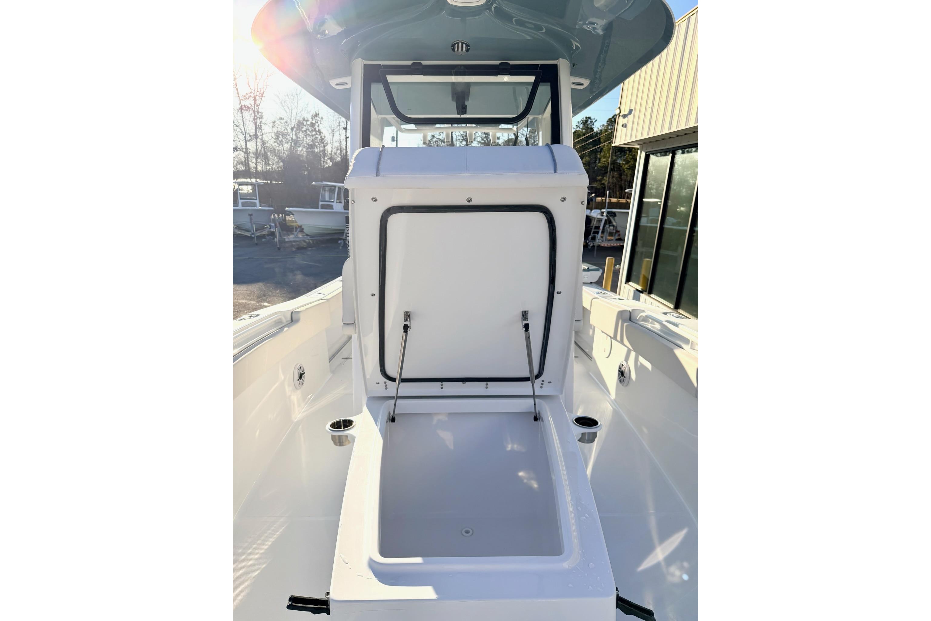 2026 Sea Hunt Ultra 275 Coffin Box open on deck, showcasing storage space.