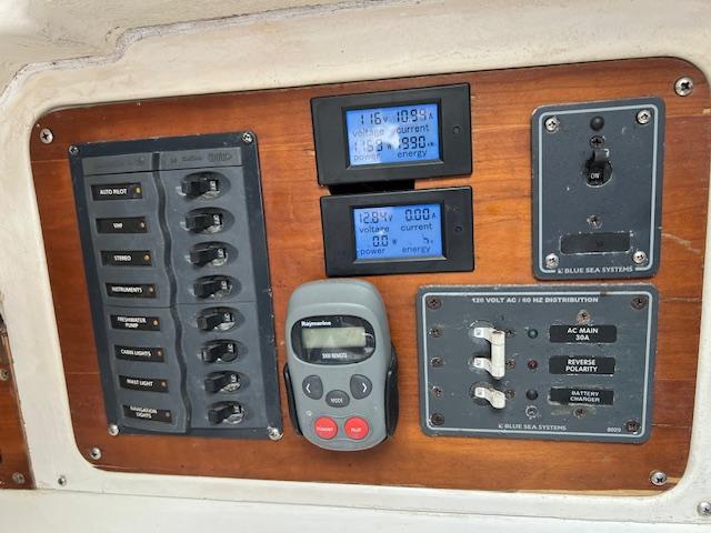 1999 Contour 34 SC control panel with switches, meters, and navigation equipment.