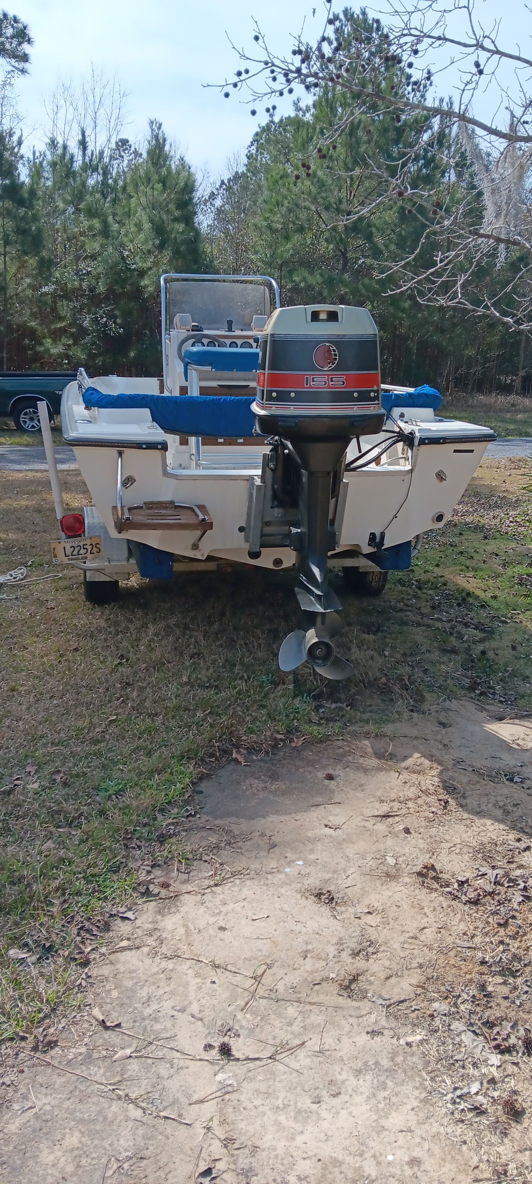 A 1990 Hydra-Sports Vector boat on a trailer outdoors.