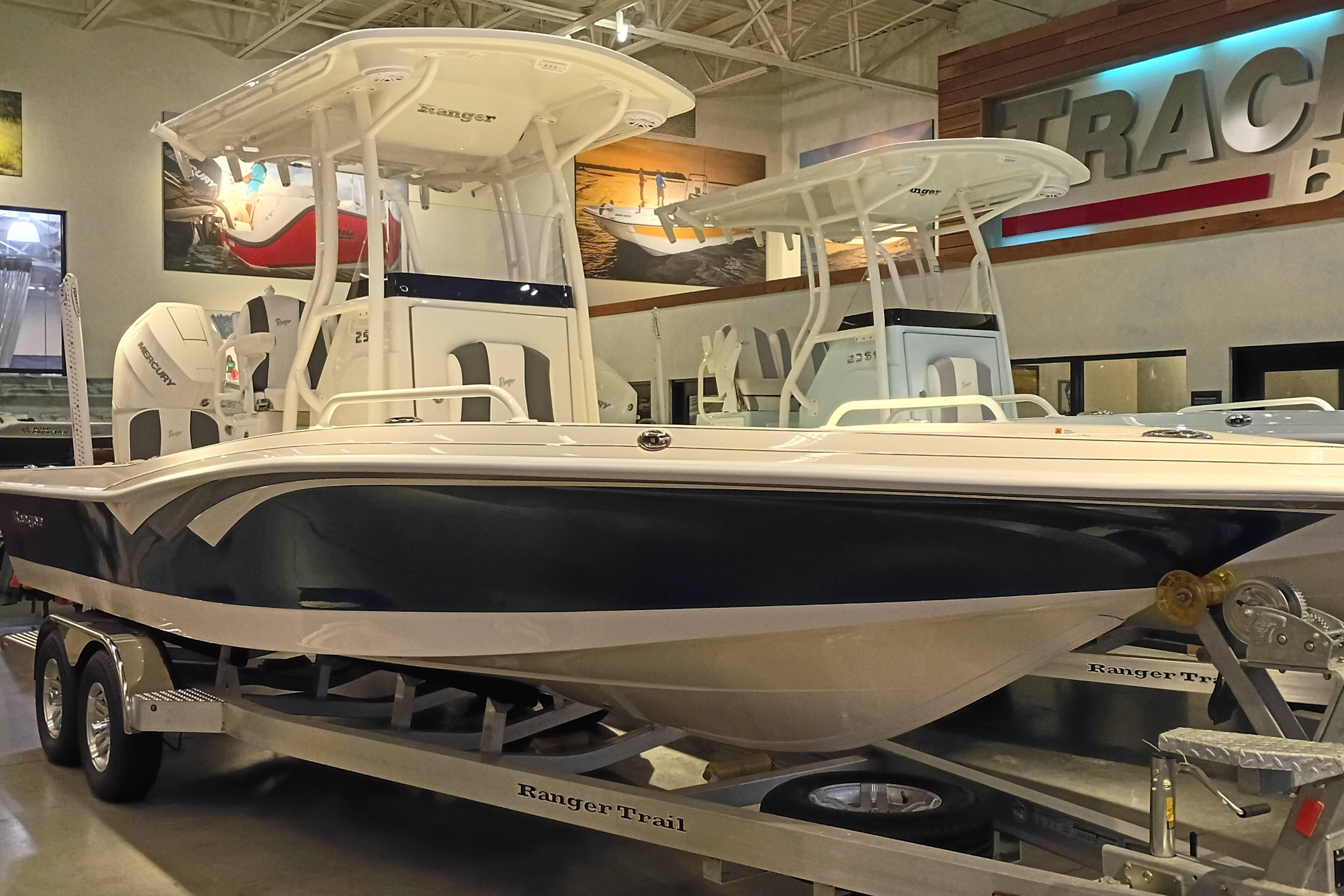 2025 Ranger 2510 Bay boat displayed in showroom on trailer.