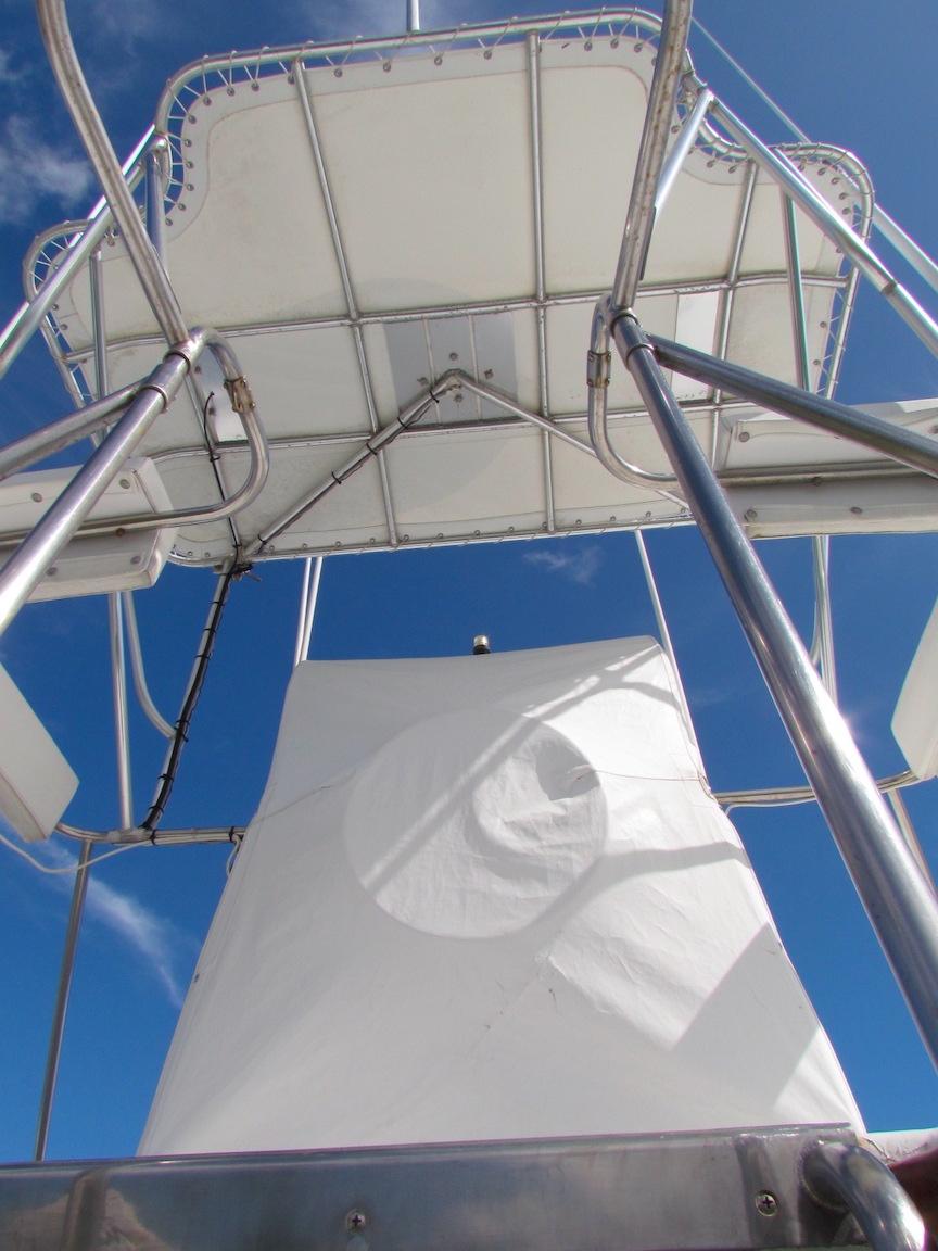 View of Hargrave 67 Motor Yacht's upper deck structure against a clear blue sky.