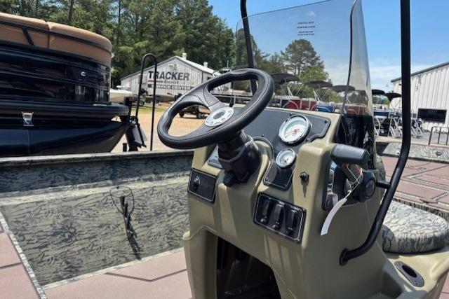 2026 Tracker Grizzly 2072 CC boat dashboard with steering wheel and gauges.