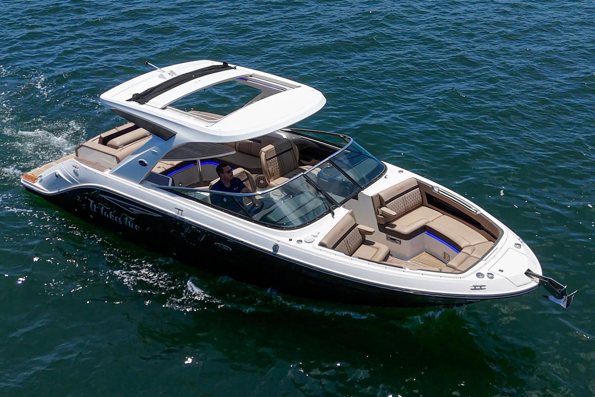 2018 Sea Ray SLX 310 boat cruising on open water, featuring sleek design and spacious seating.