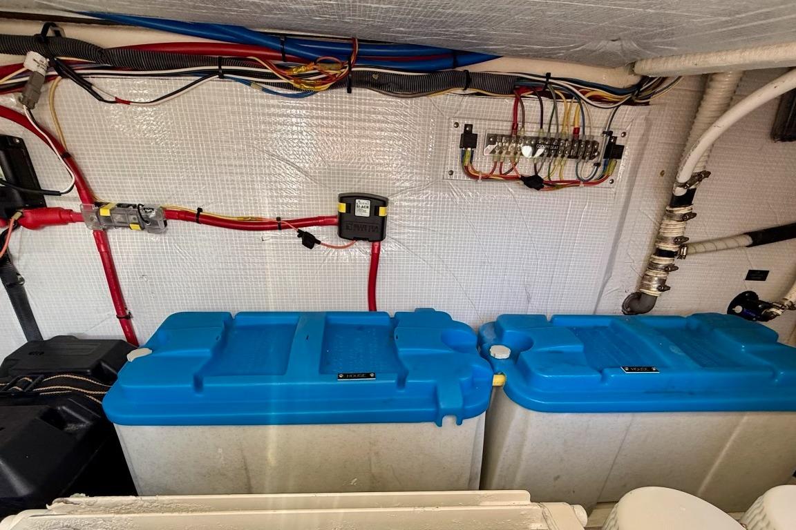 Electrical wiring and blue water tanks in 2015 Sabre 38 Salon Express yacht.