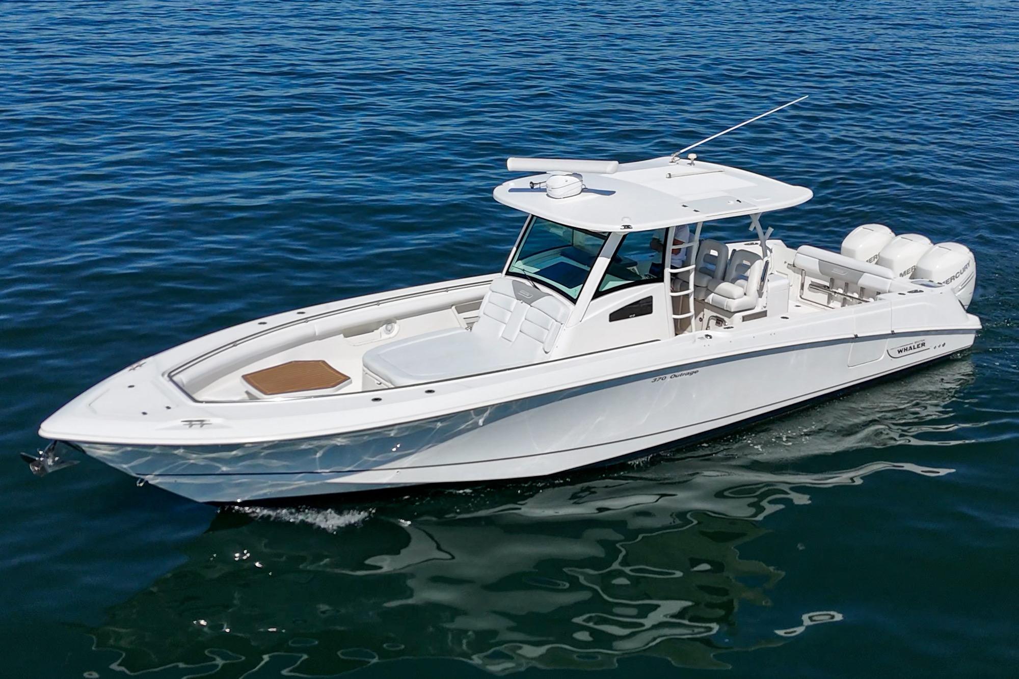 2015 Boston Whaler 370 Outrage boat cruising on open water.