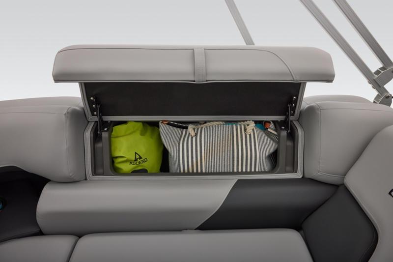 2026 Sun Tracker Party Barge 22 DLX storage compartment with bags inside.