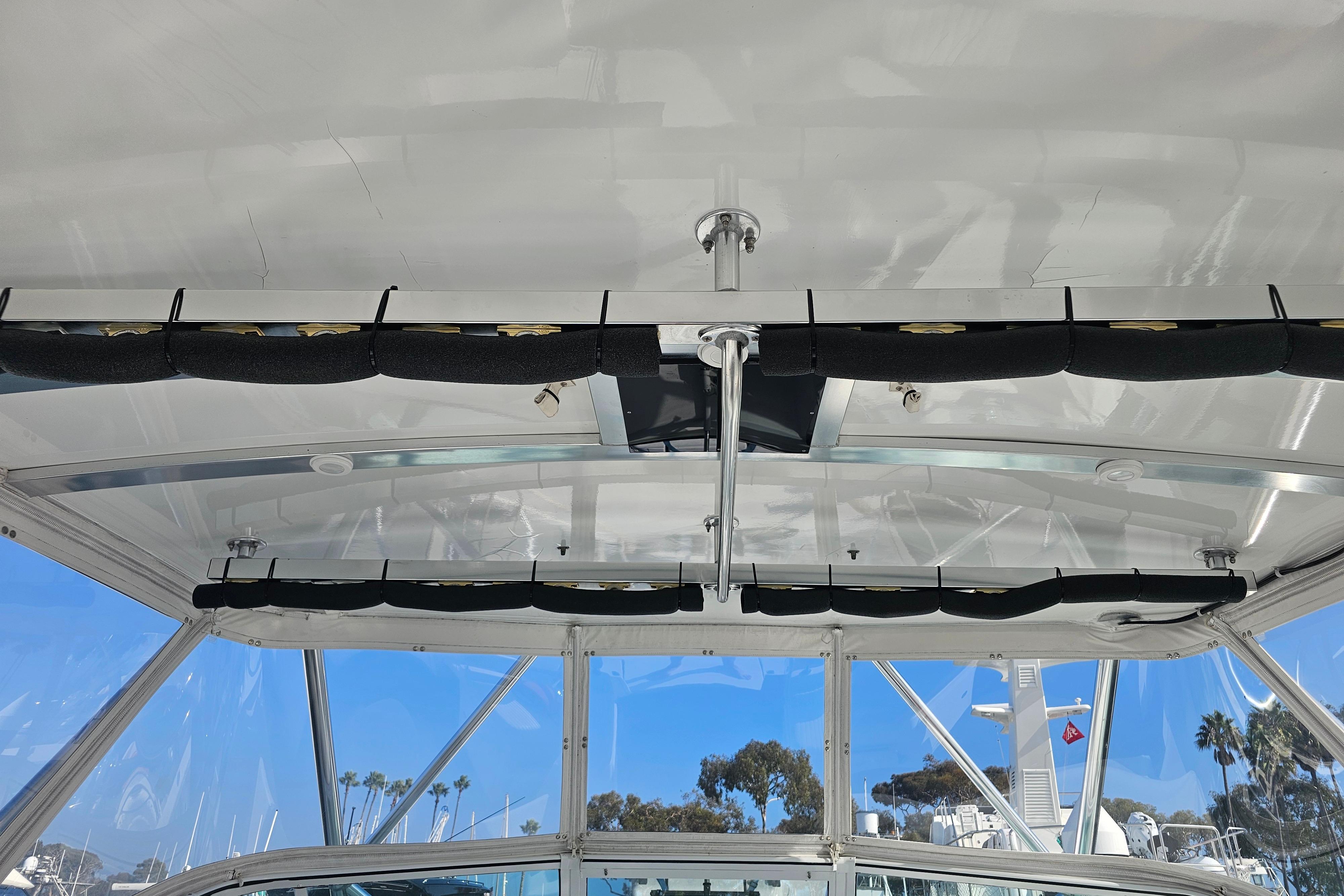 Interior view of a 2003 Topaz 32 Express boat with rod holders.