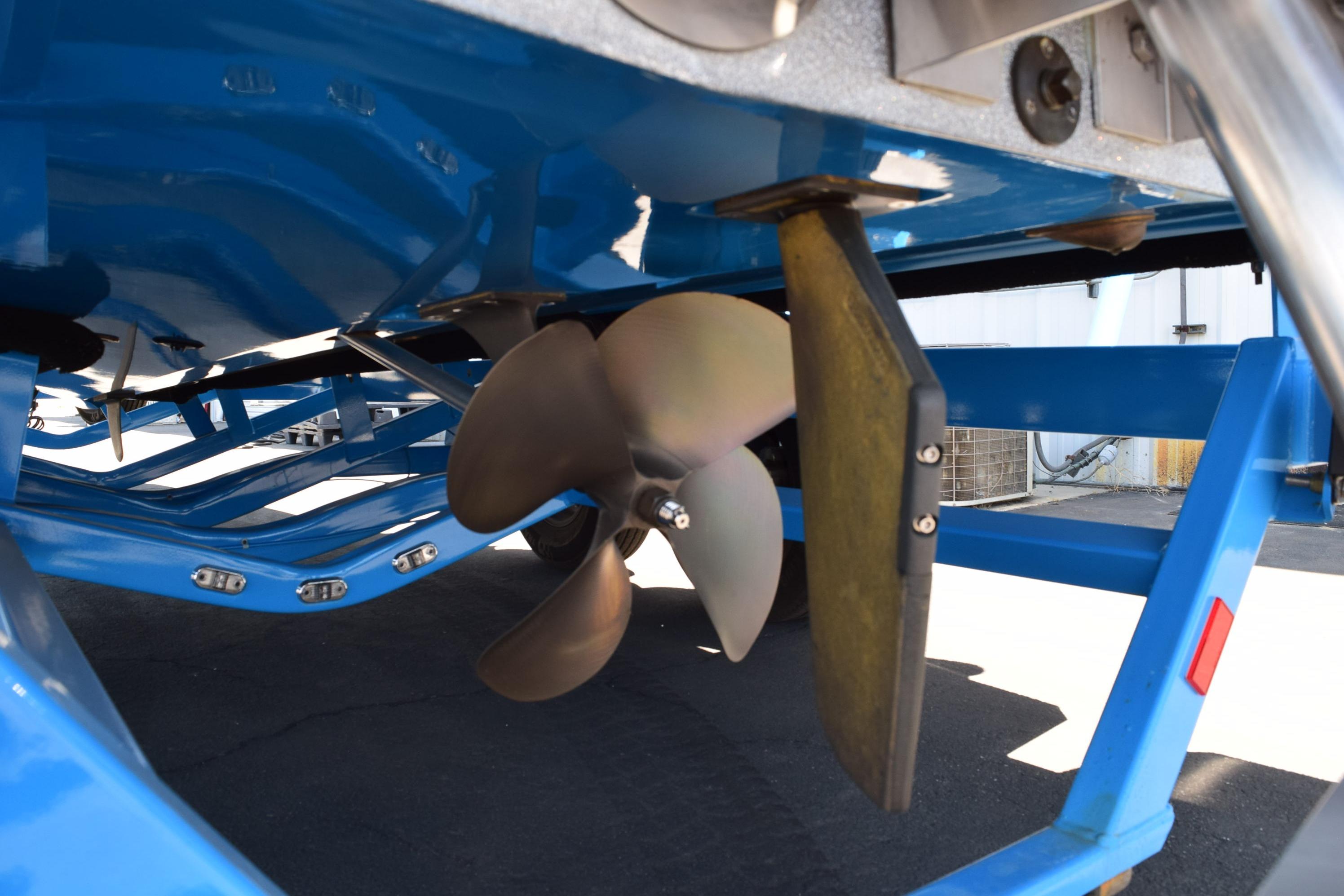 2019 Axis A22 boat propeller and rudder, showcasing underside details in a blue finish.
