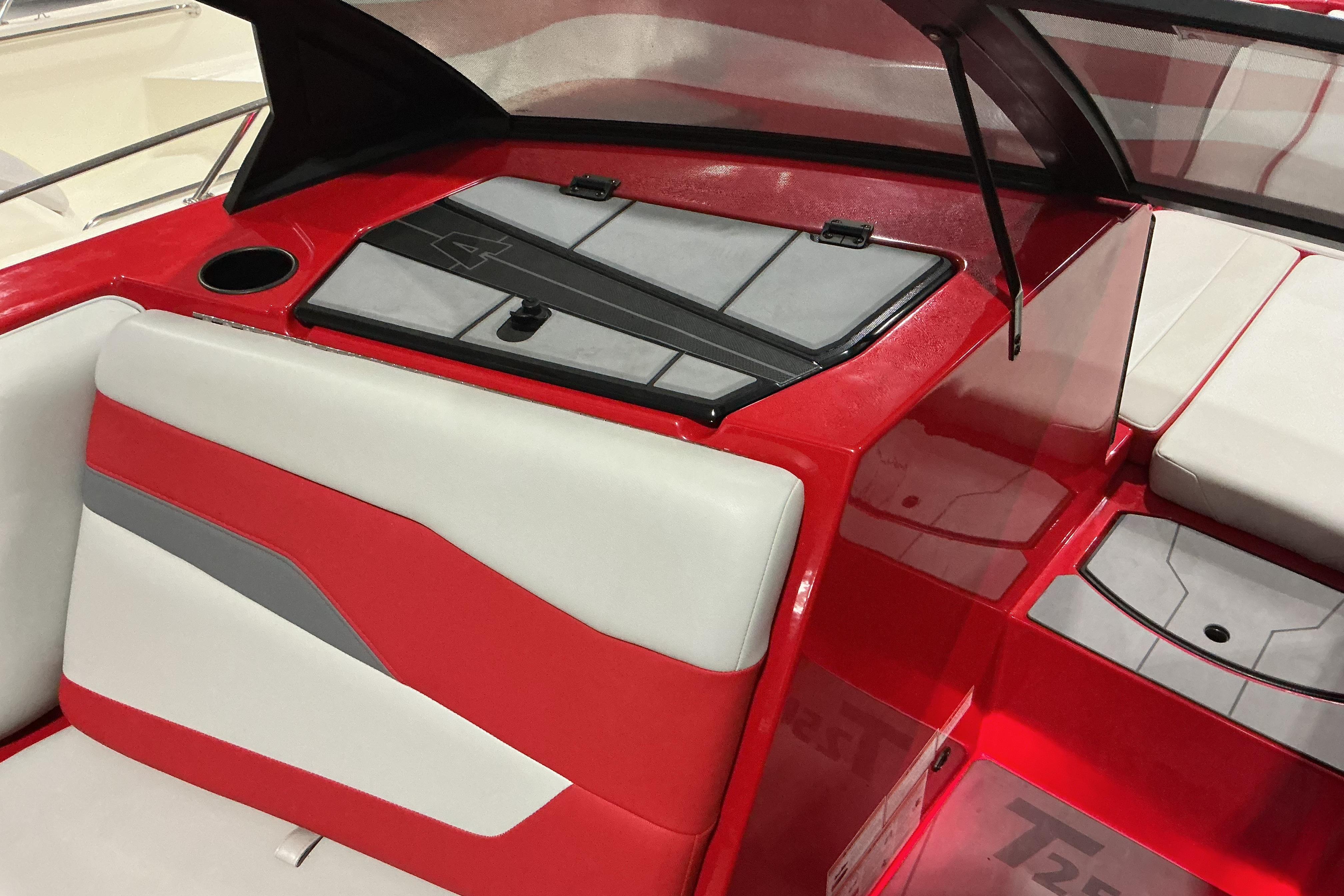 2022 Axis T250 boat interior with red and white seating and storage compartments.