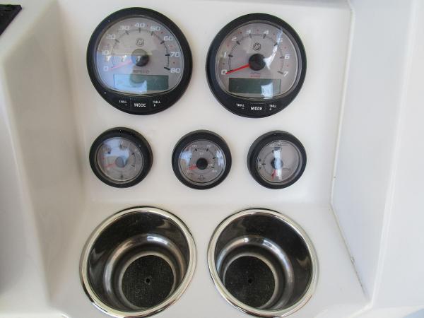 Dashboard of 2024 Ranger 2660 Bay boat with gauges and cup holders.