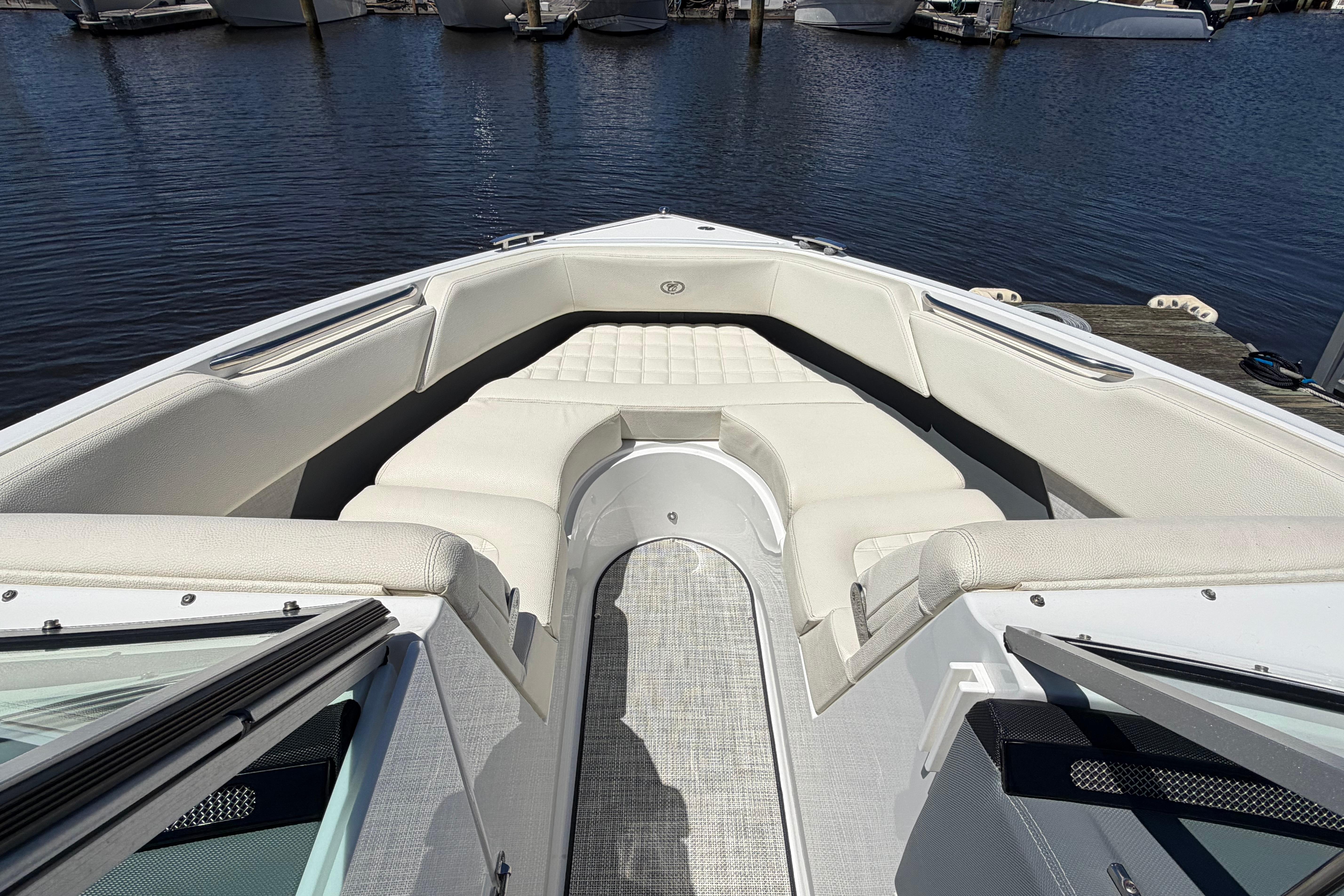 2020 Cobalt R3 boat interior with white seating, docked by the water.