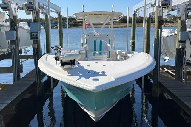 2002 Yellowfin 31 Center Console boat docked on a lift, ready for adventure.