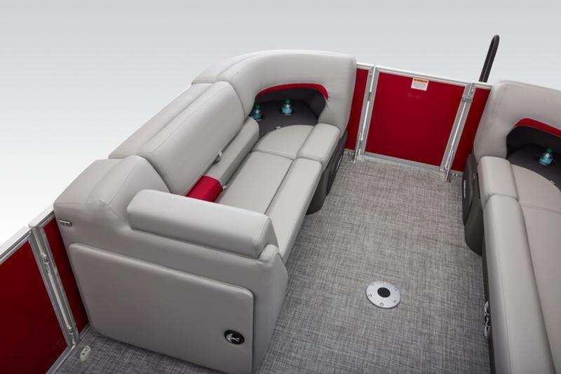 2026 Sun Tracker Party Barge 22 DLX interior with gray seating and red accents.