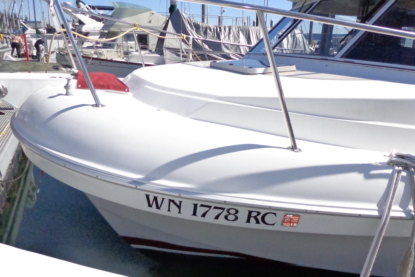 Cruise-A-Home Corsair 4200 boat, 1992 model, docked with visible registration number.