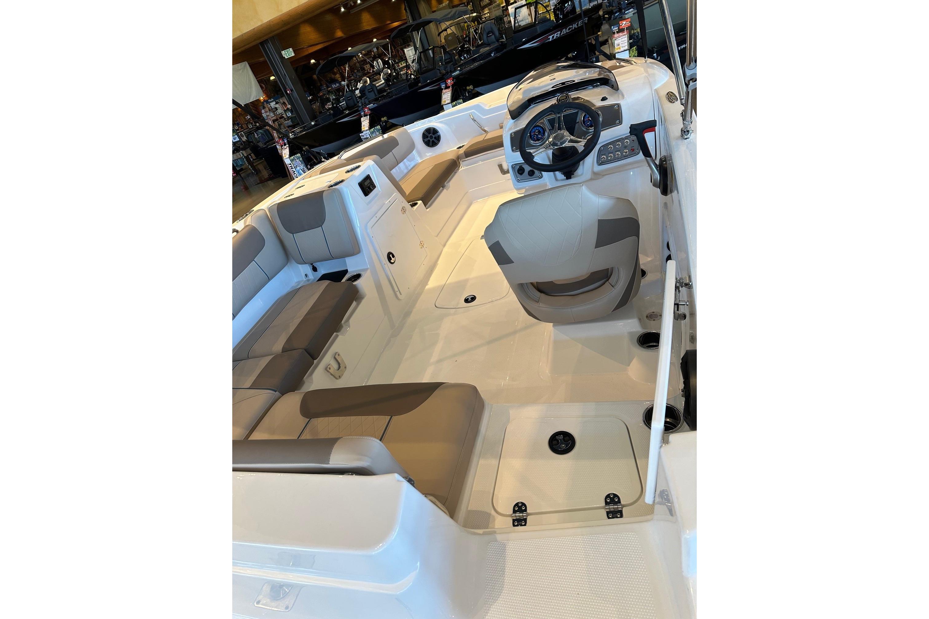 Interior of 2026 Tahoe 1950 boat with seating and steering console.