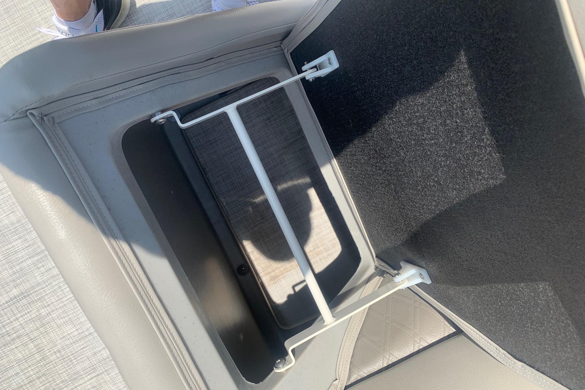 Storage compartment in 2023 Silver Wave 2410 SW3 CLS boat, featuring sleek interior design.