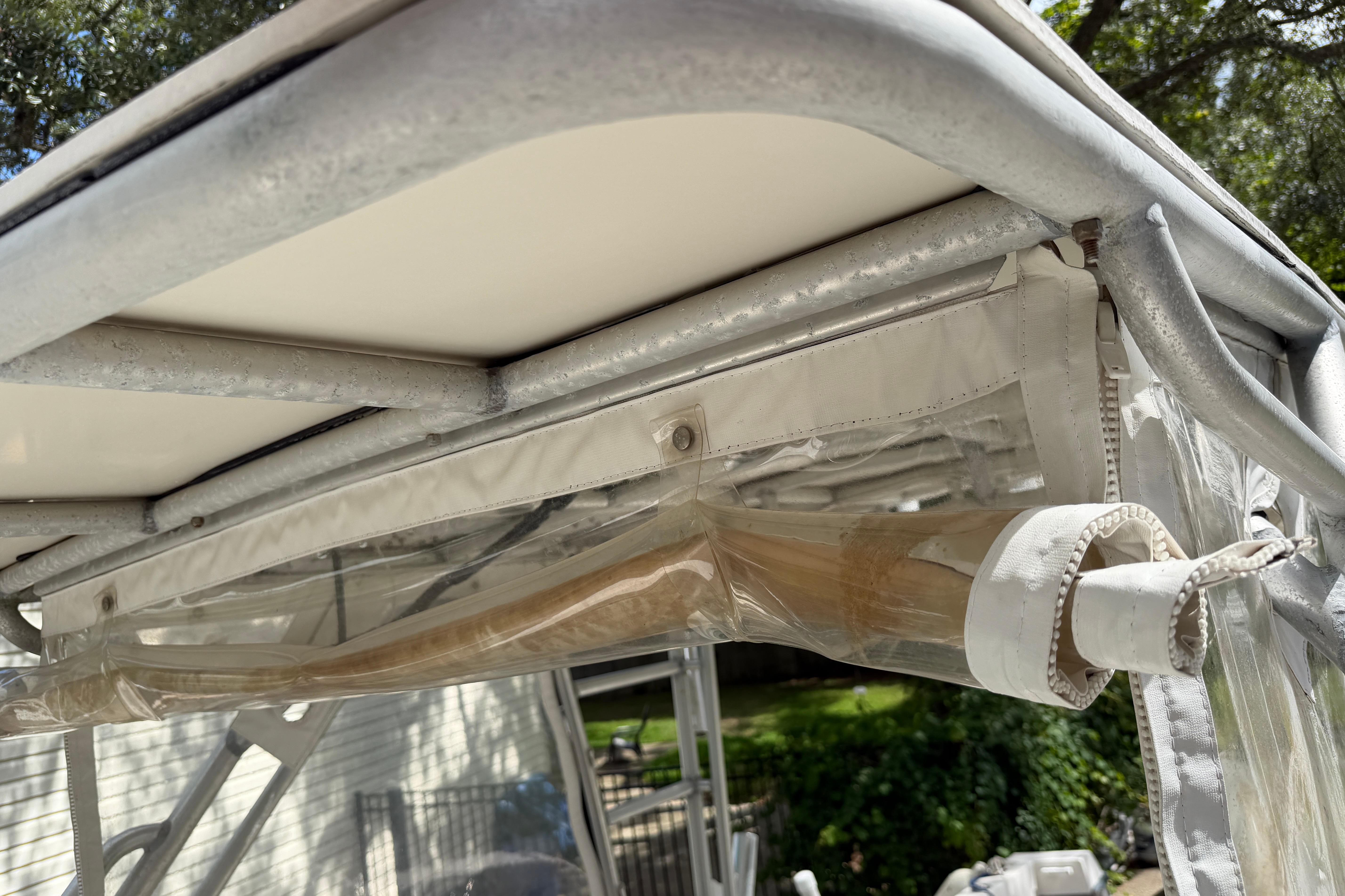 Close-up of 1987 Grady-White Seafarer 226 boat canopy and frame details.