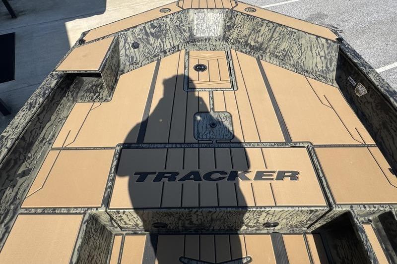 2026 Tracker Grizzly 1756 T Marsh boat interior with camouflage design and shadow.