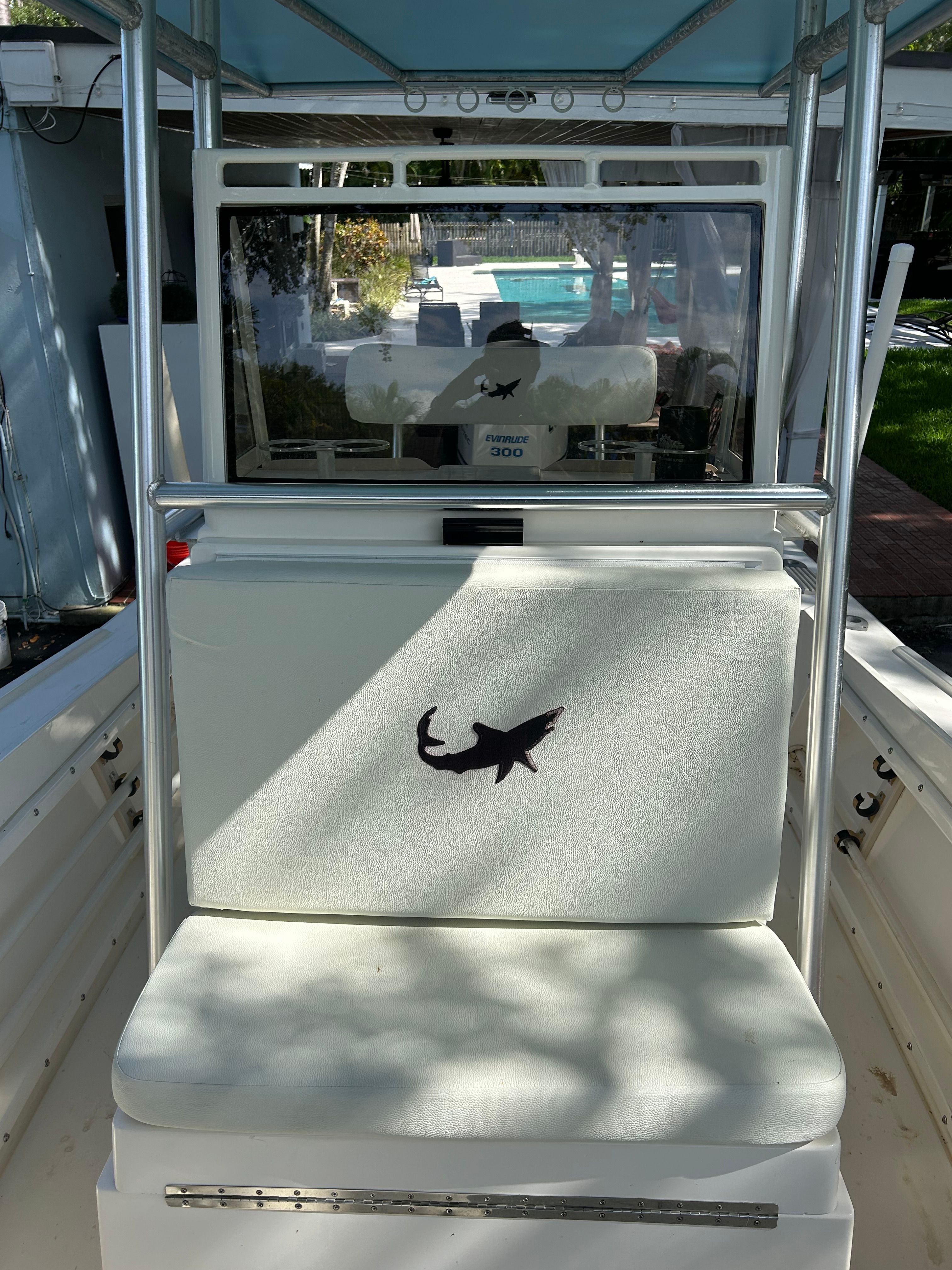 1992 Mako 221 boat with shark logo on seat cushion.